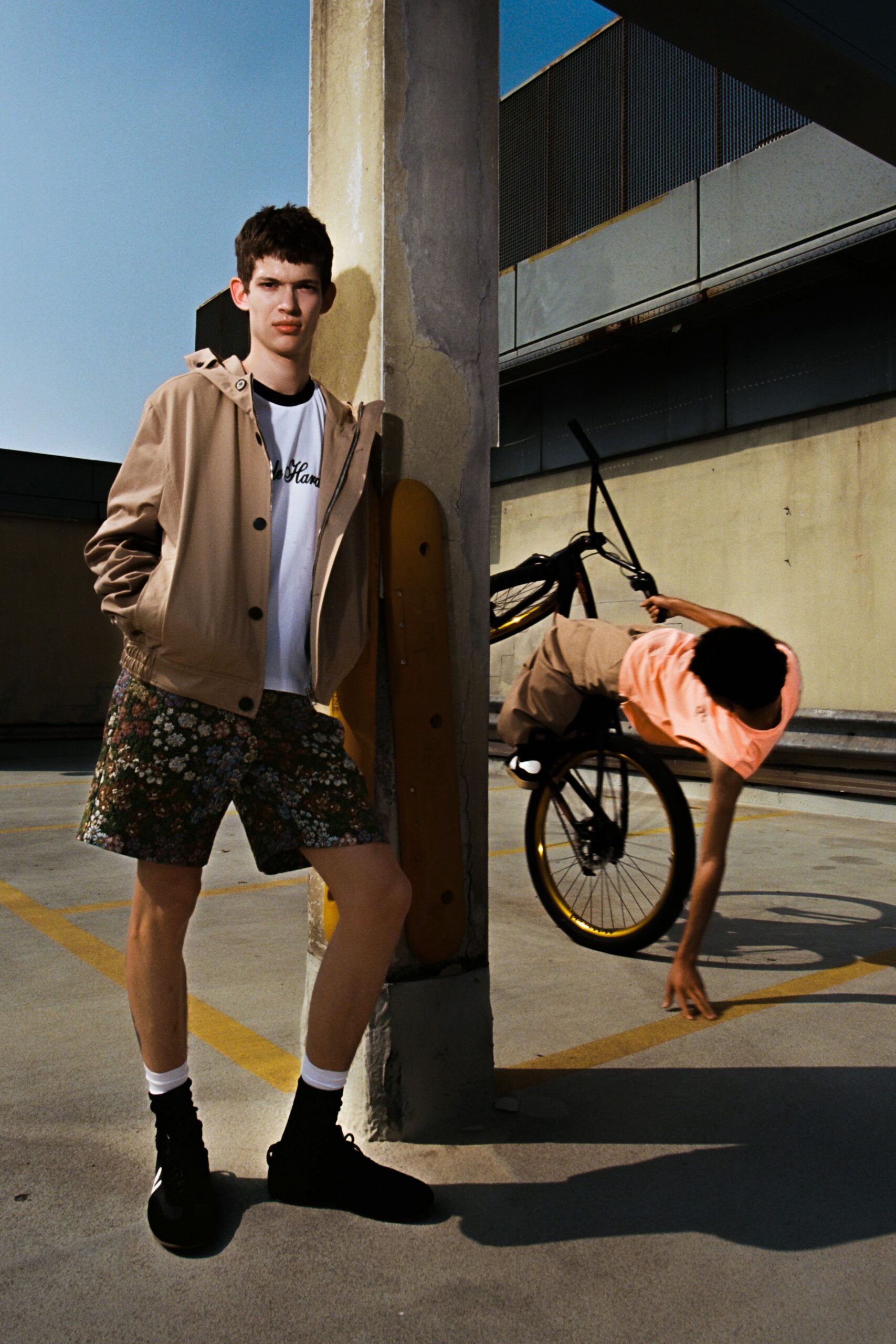 beige jacket white t-shirt floral shorts