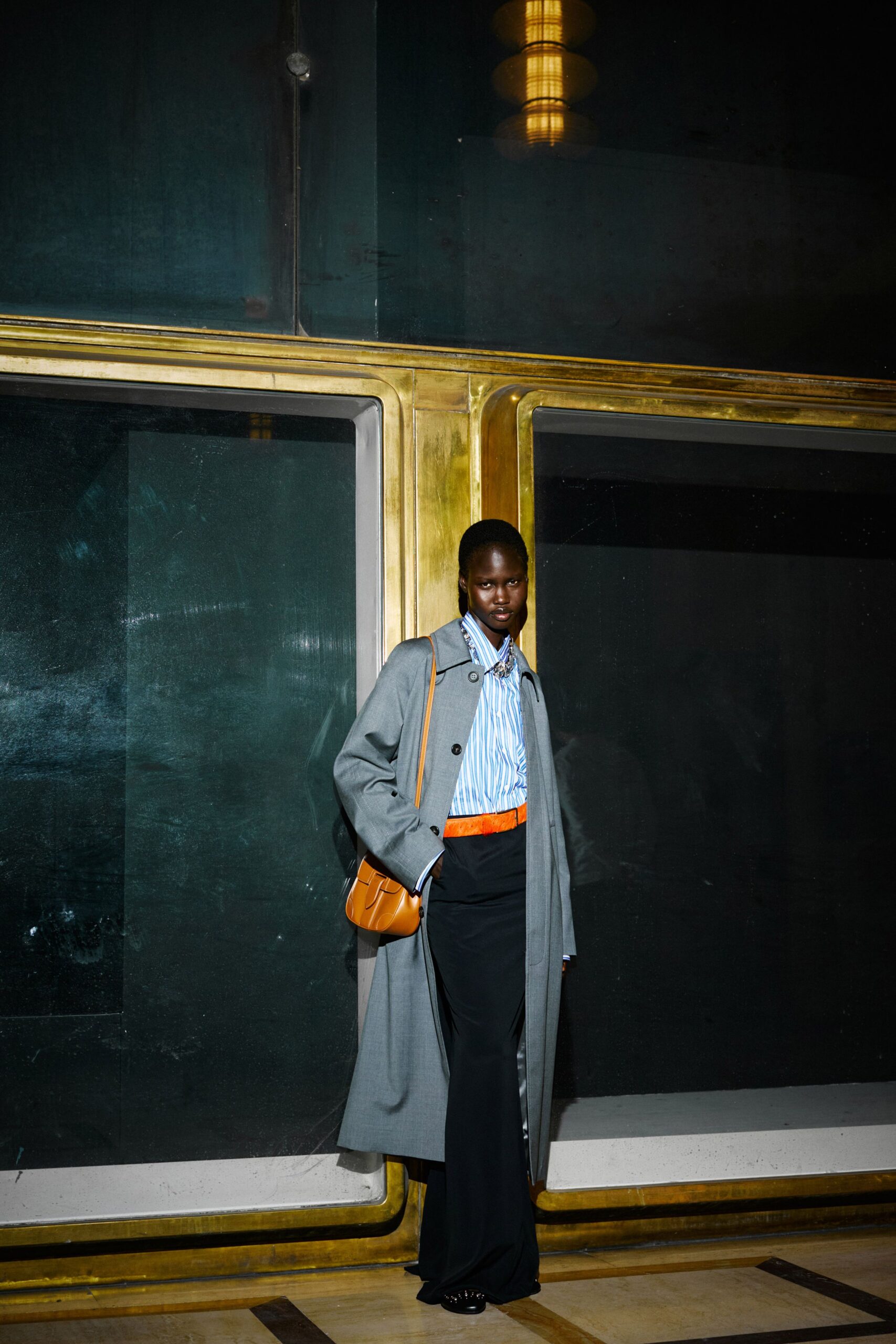 gray trench coat with striped shirt