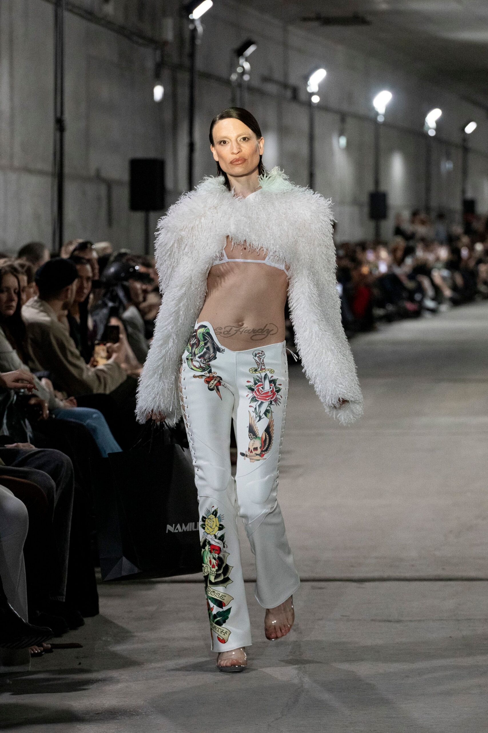 beige fitted top with white pants