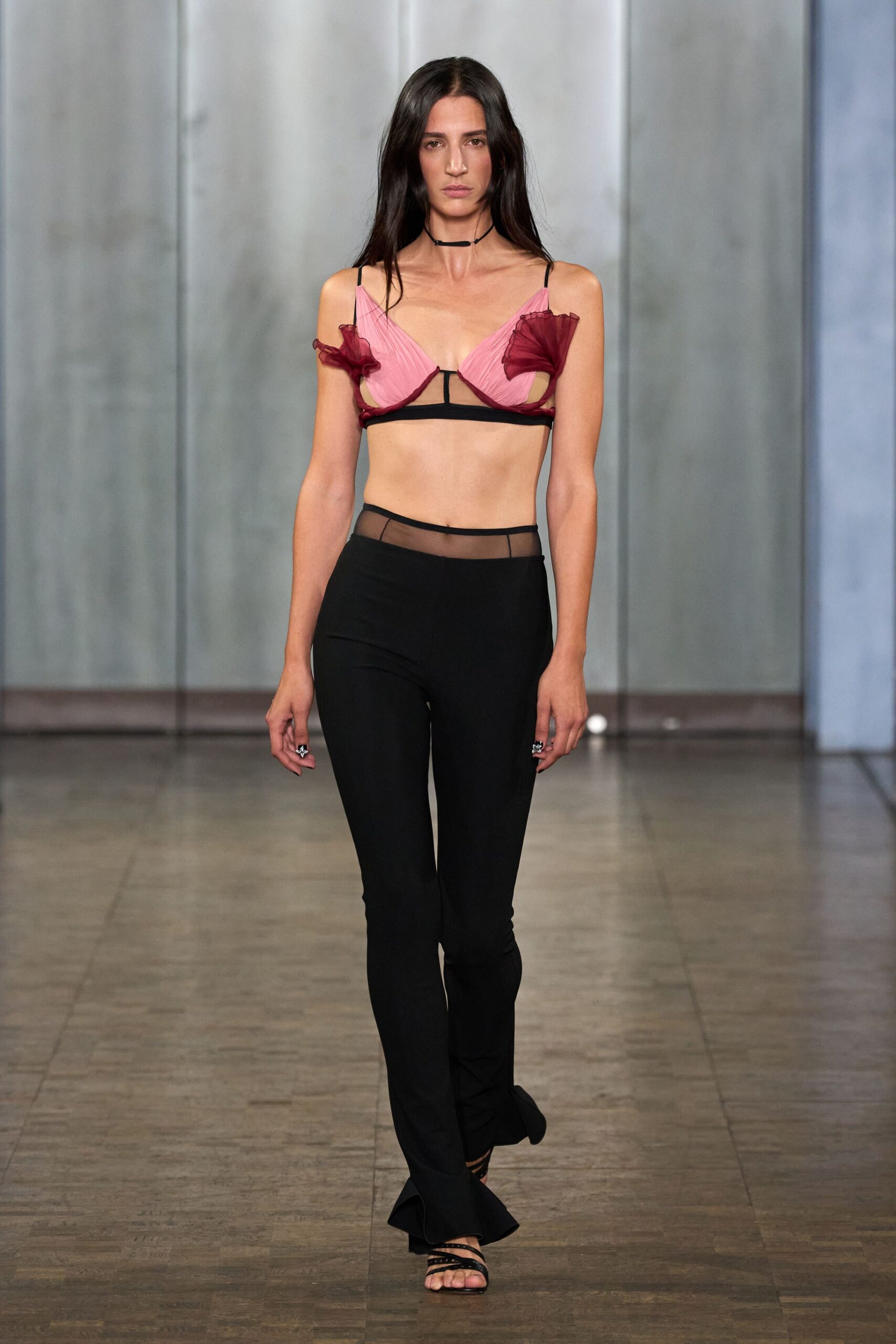 pink ruffled top black flared pants