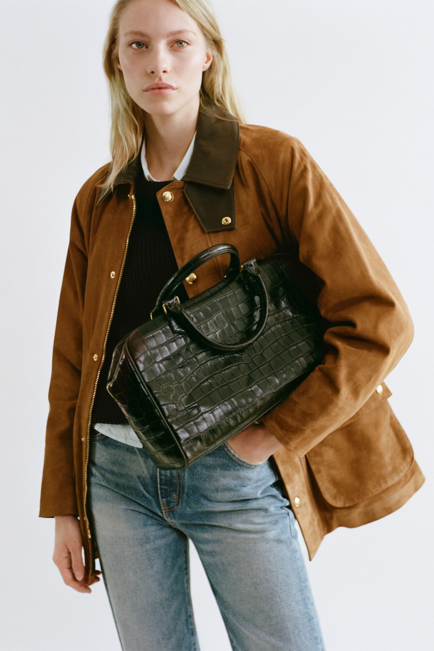 brown suede jacket with black sweater