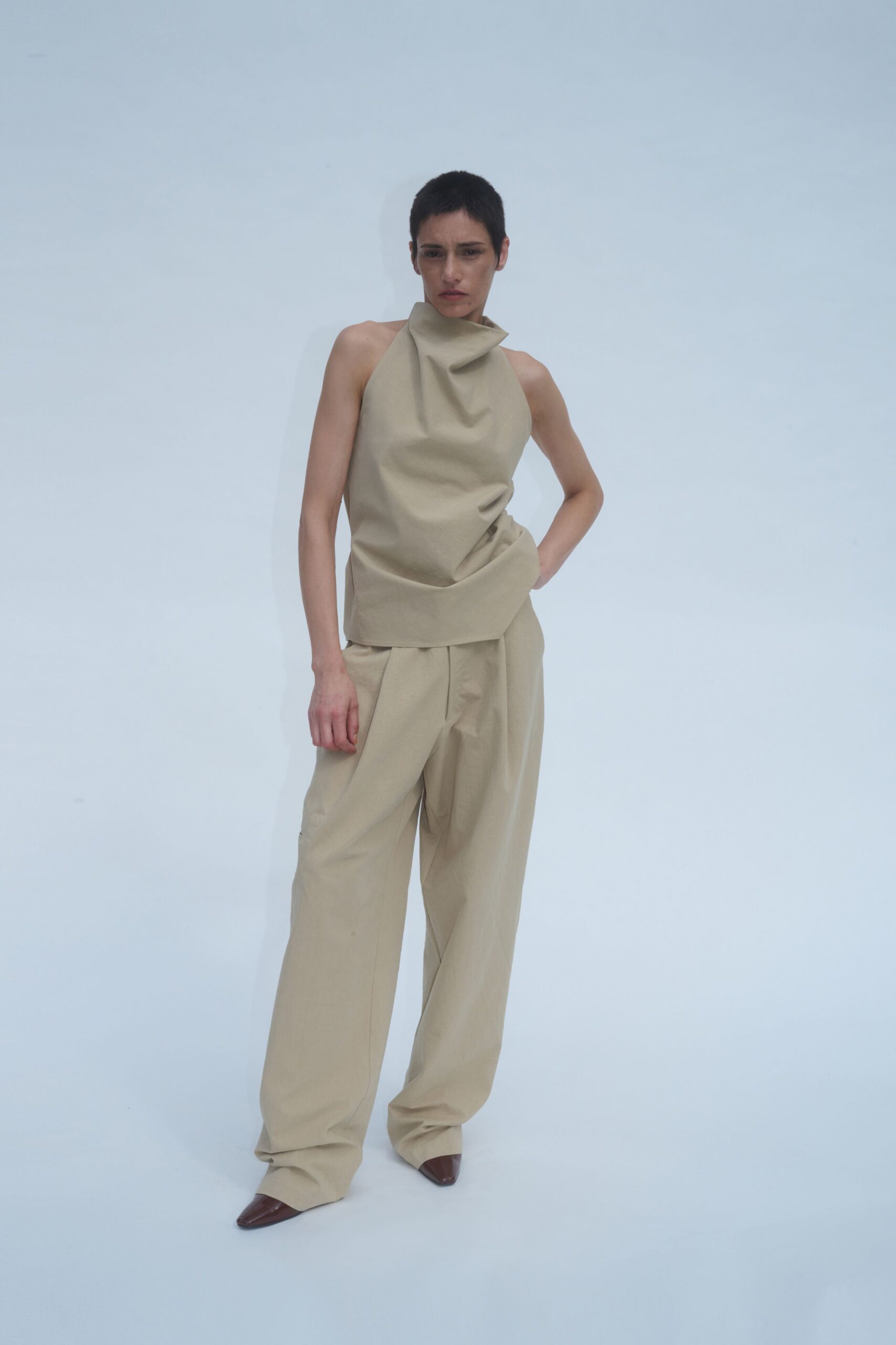 beige cotton sleeveless high-neck relaxed draped top