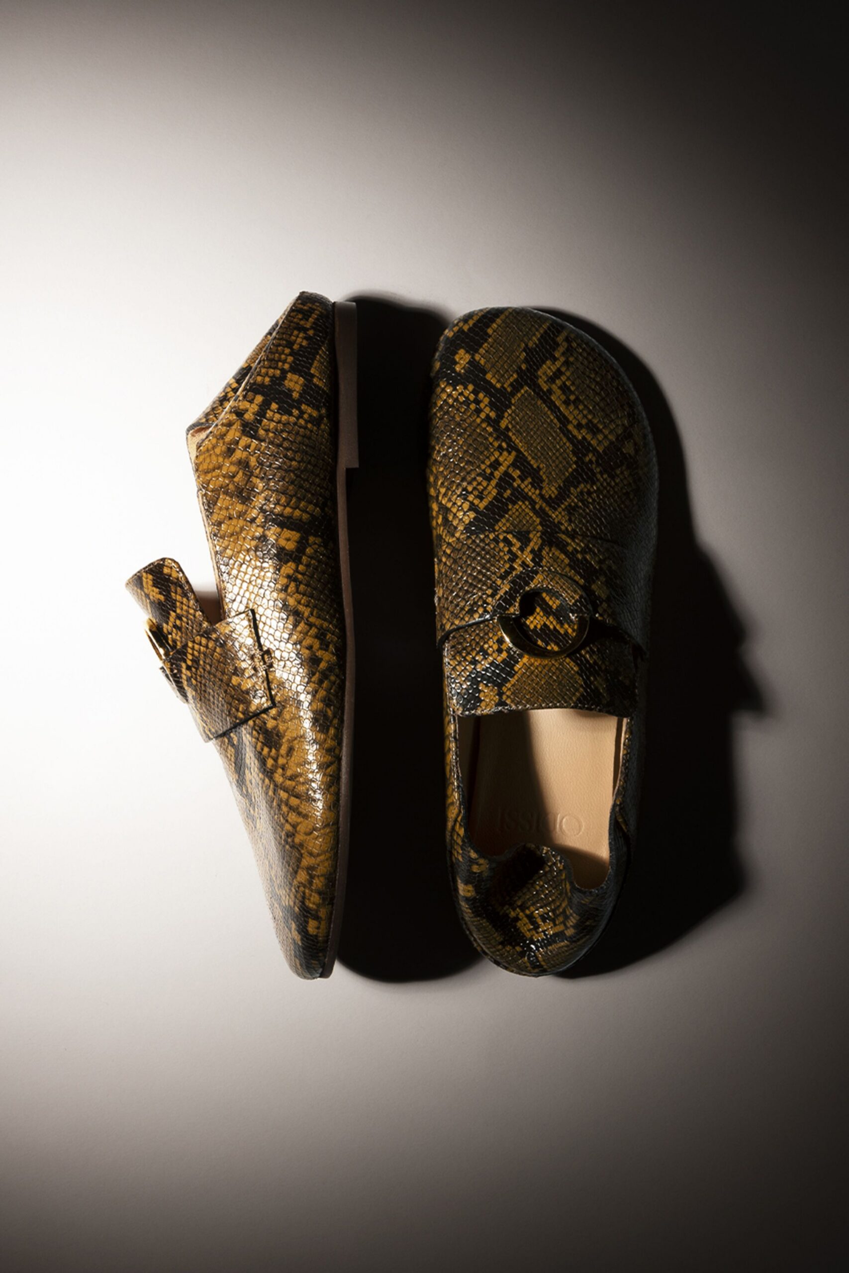 brown and black animal-print shoes