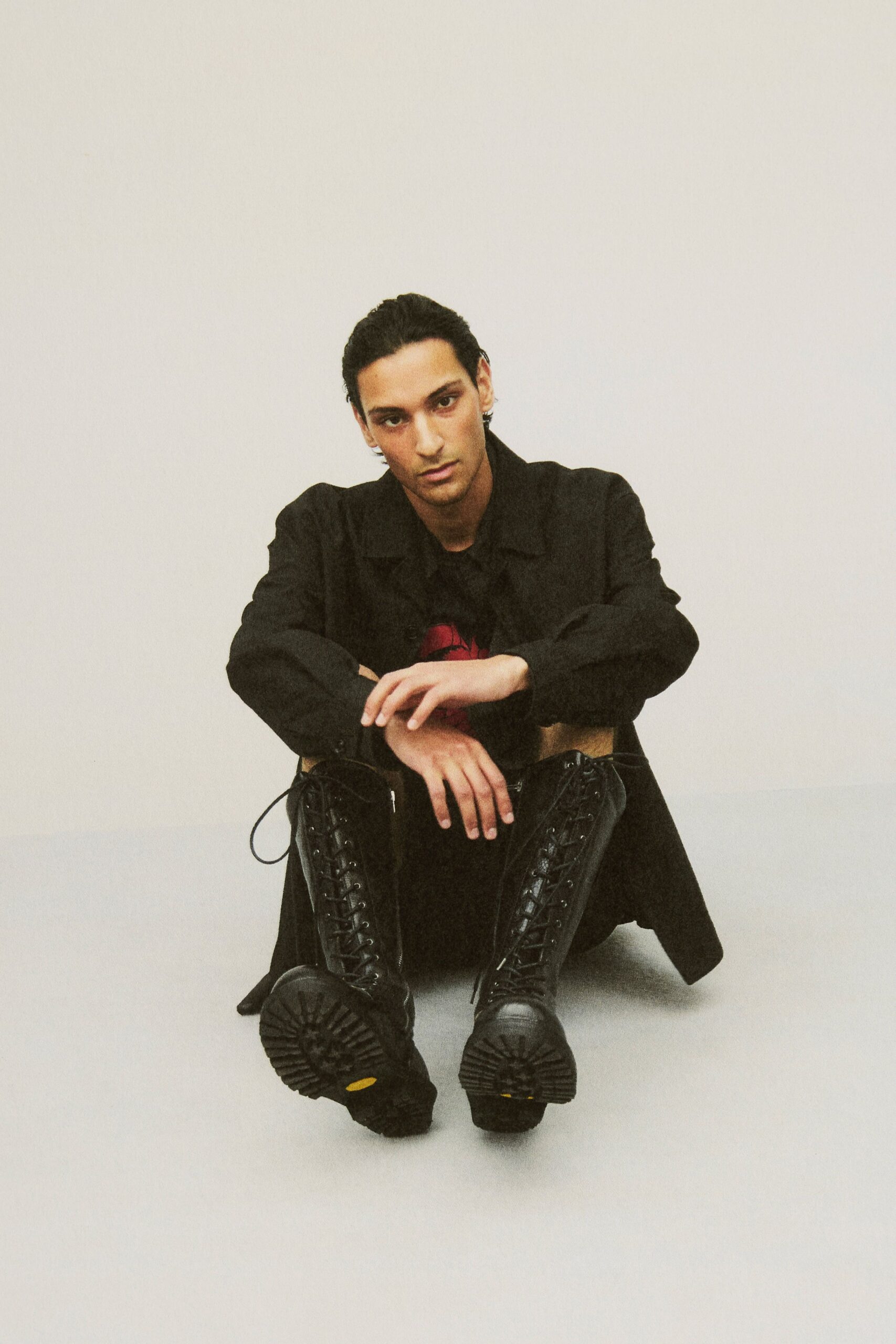 black coat and t-shirt with boots