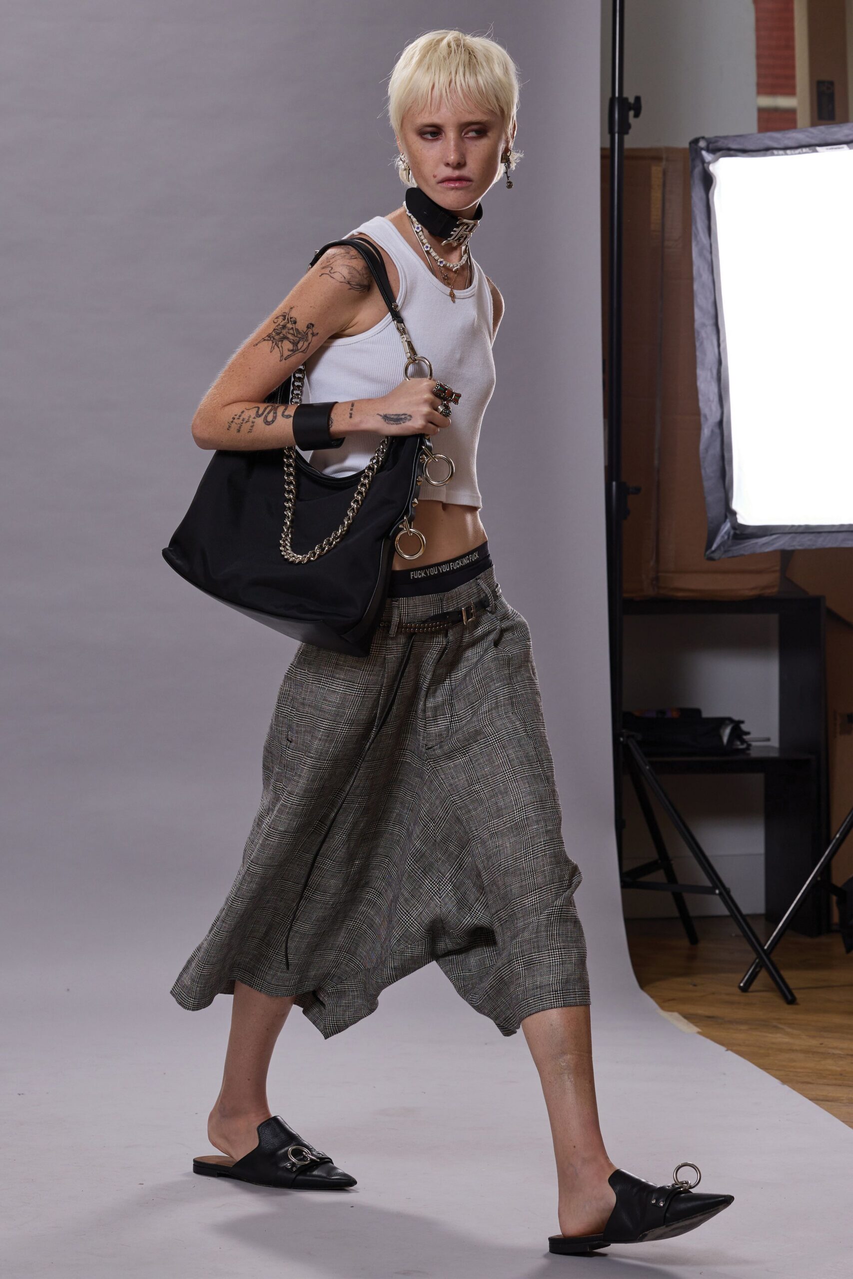white fitted top with gray pants