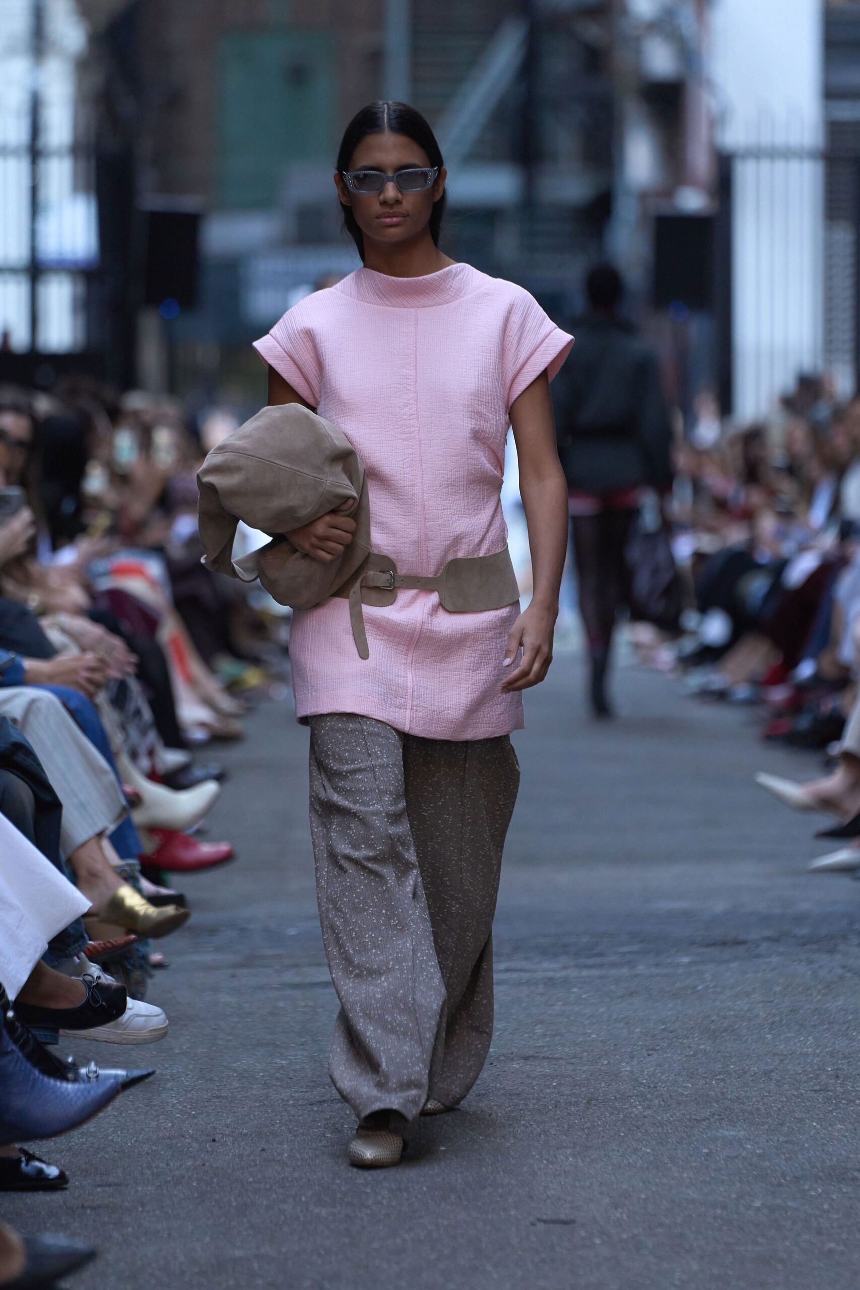 pink relaxed top with beige pants