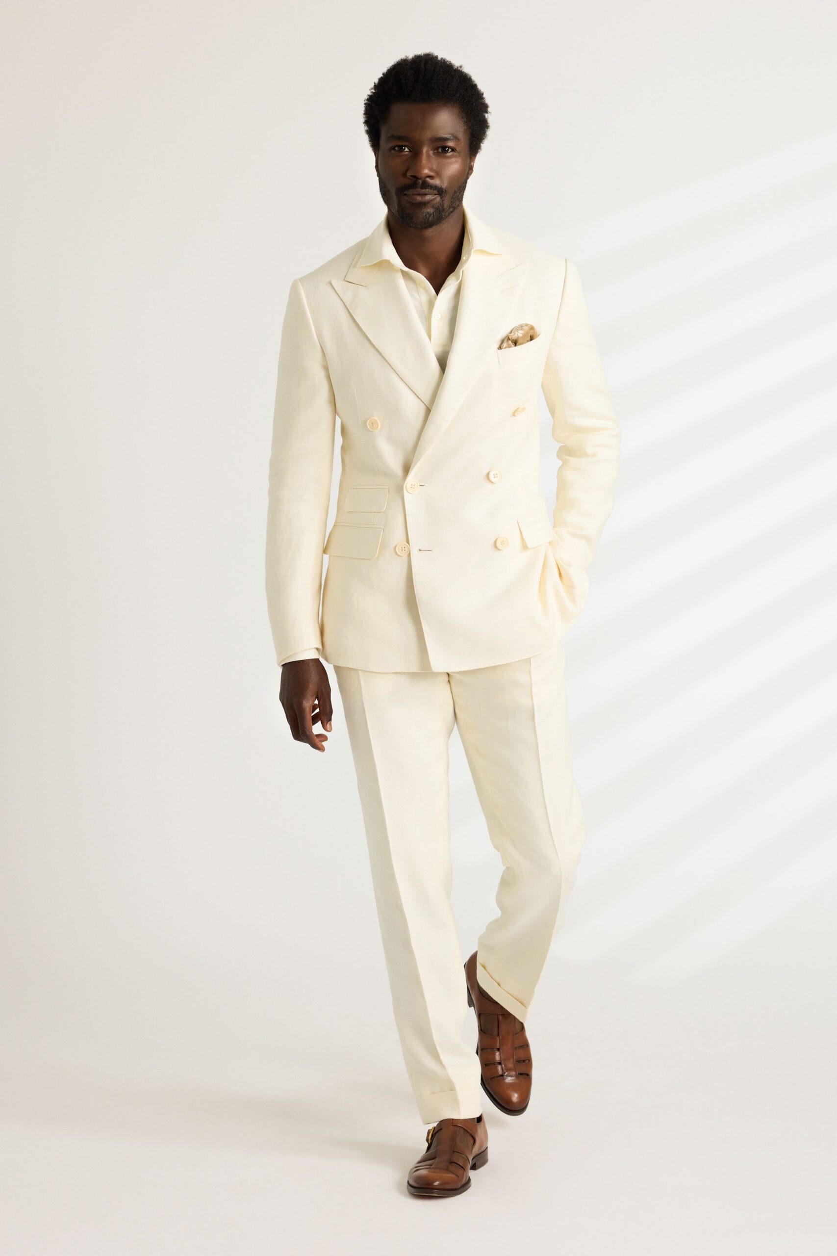 beige tailored suit with brown shoes