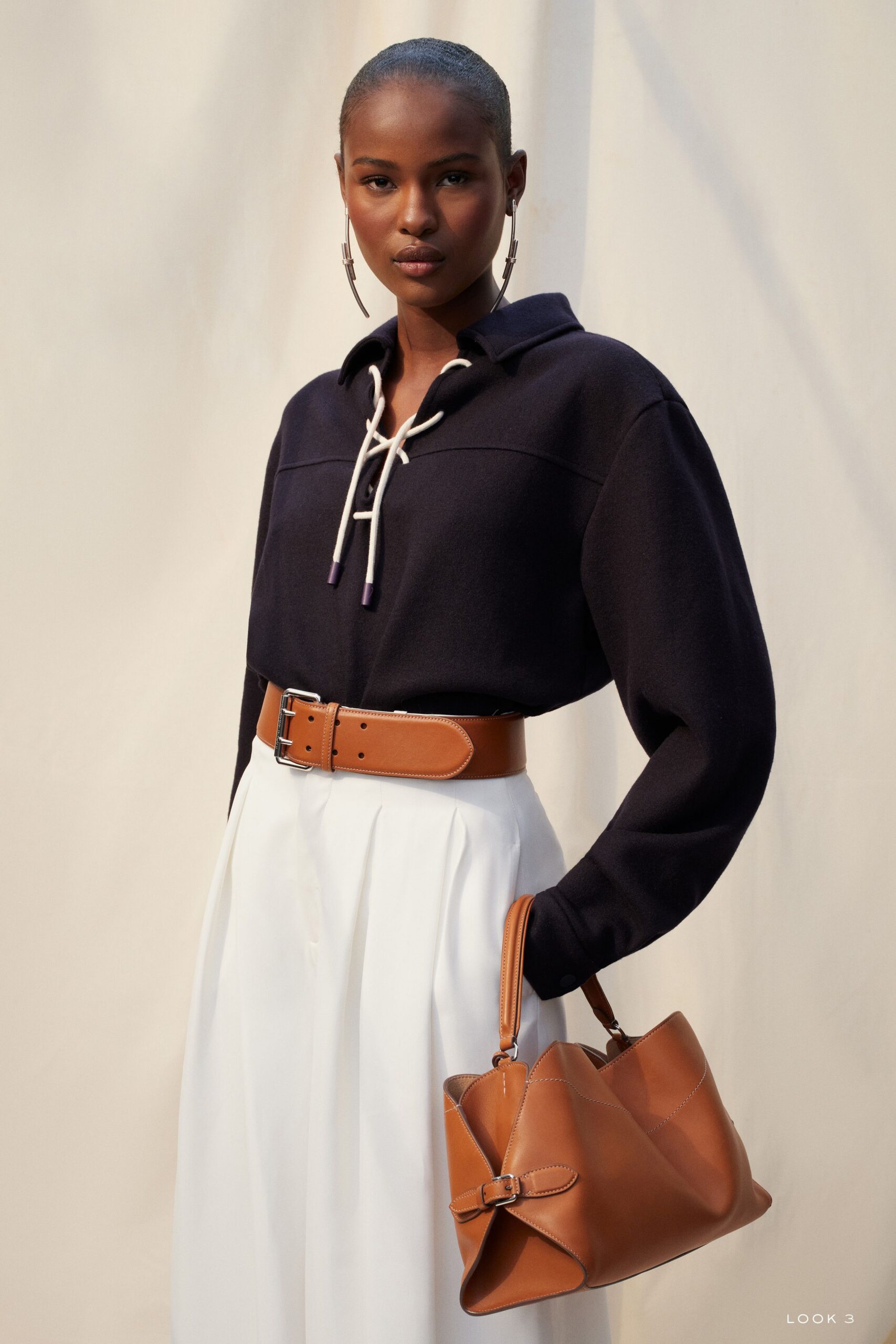 navy top with white pants