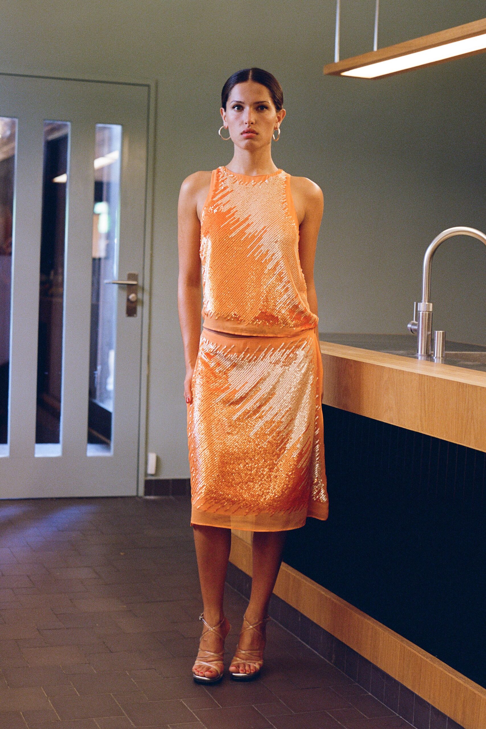 orange sequin sleeveless high-neck fitted layered shiny dress