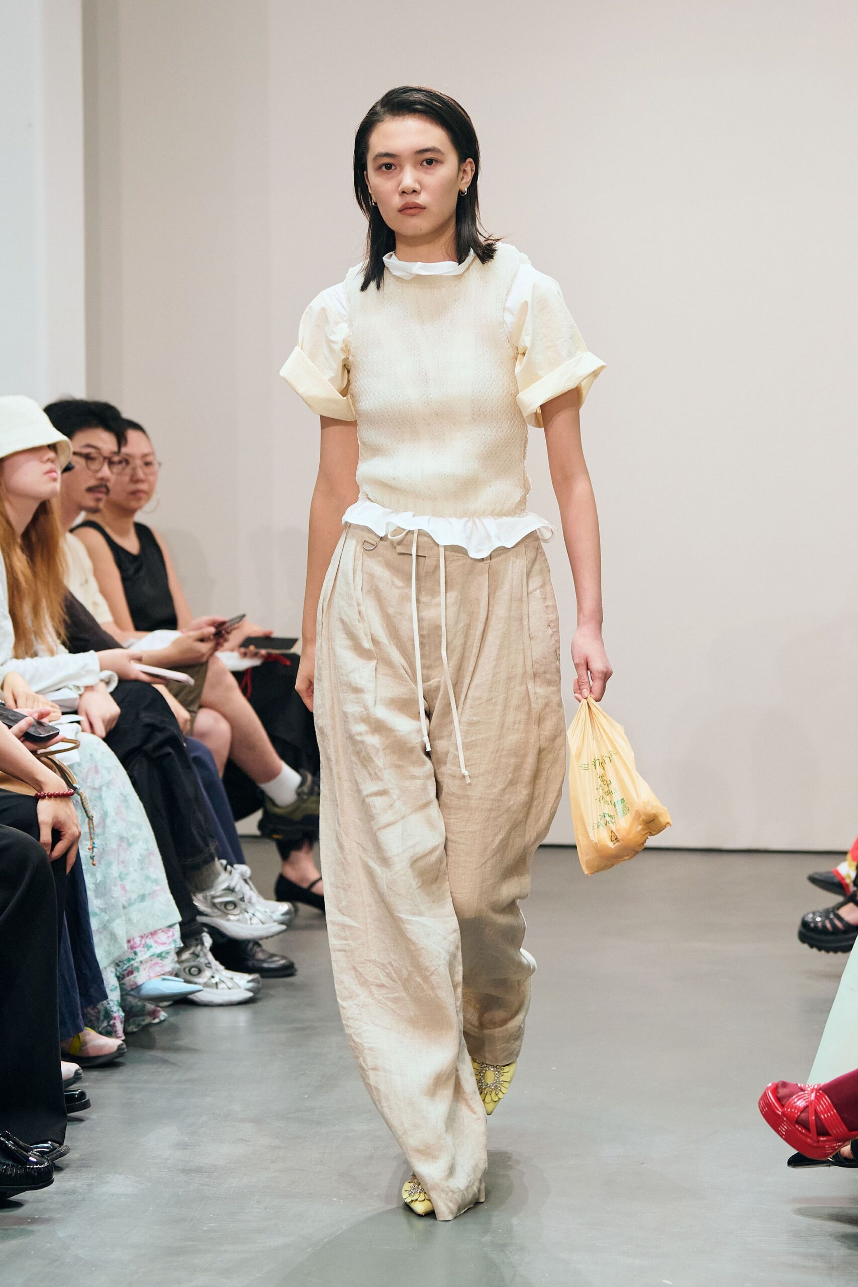 white relaxed top with beige pants