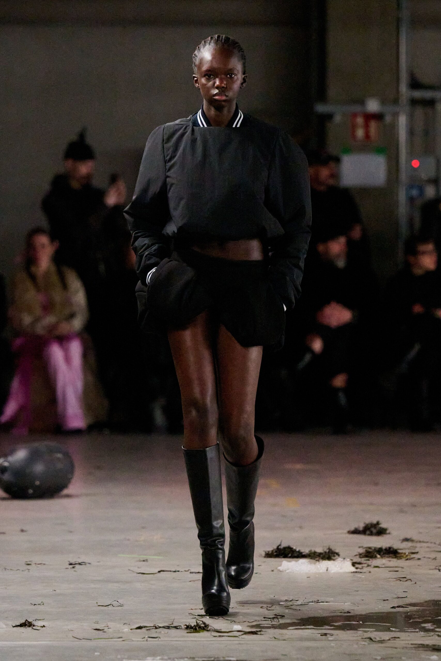 black fitted top and mini skirt