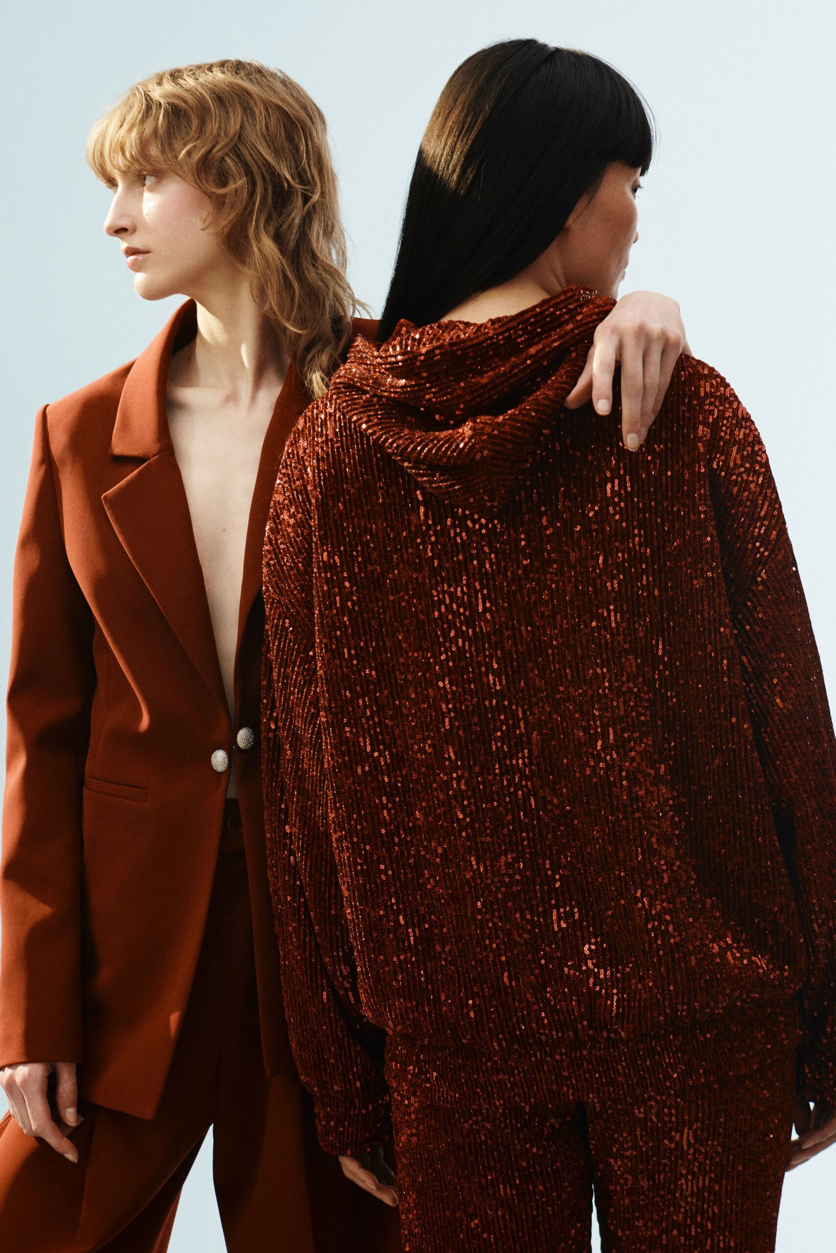 brown tailored blazer and red sequin hoodie