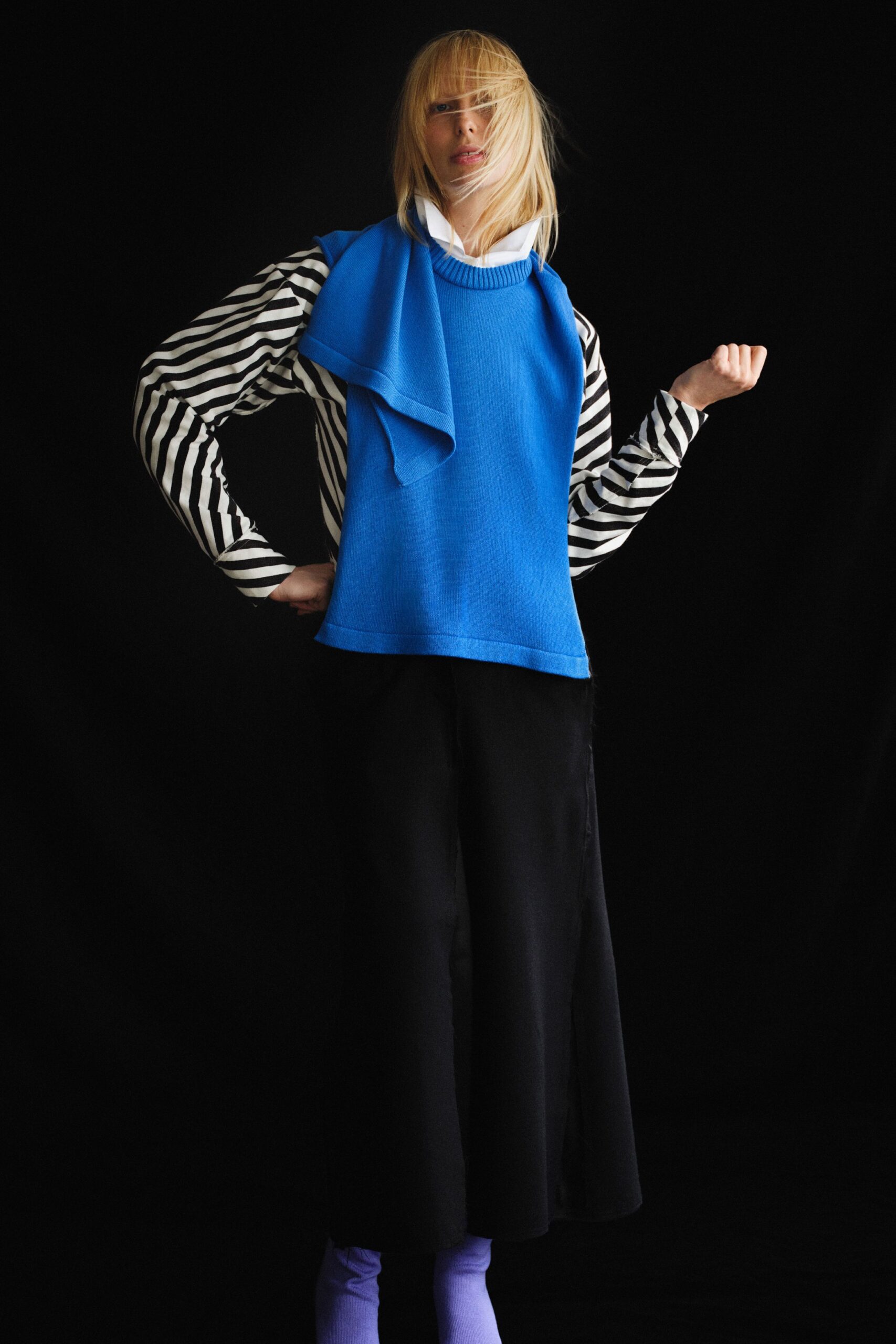 blue top with striped shirt and black skirt