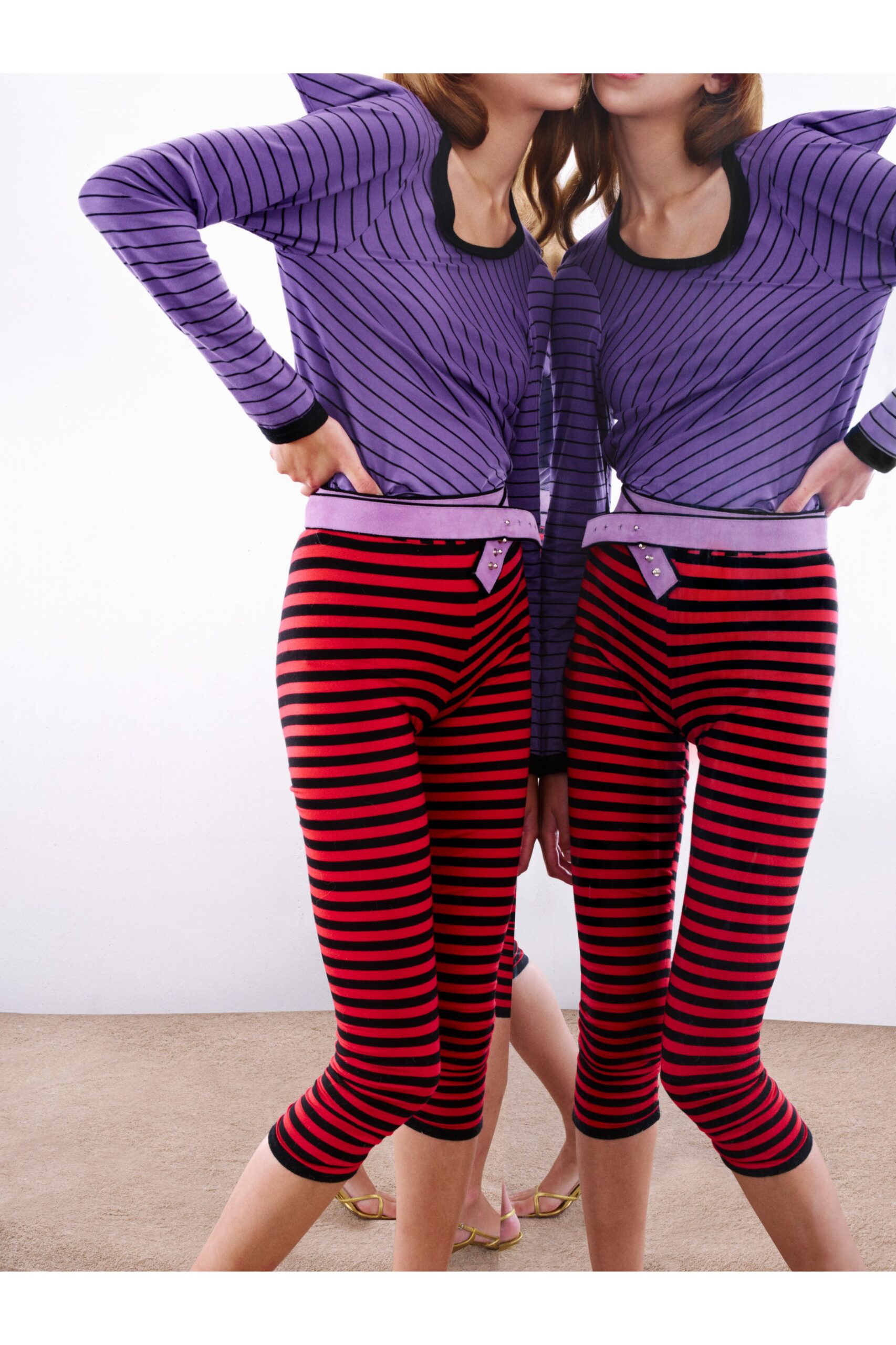 striped purple top and red leggings