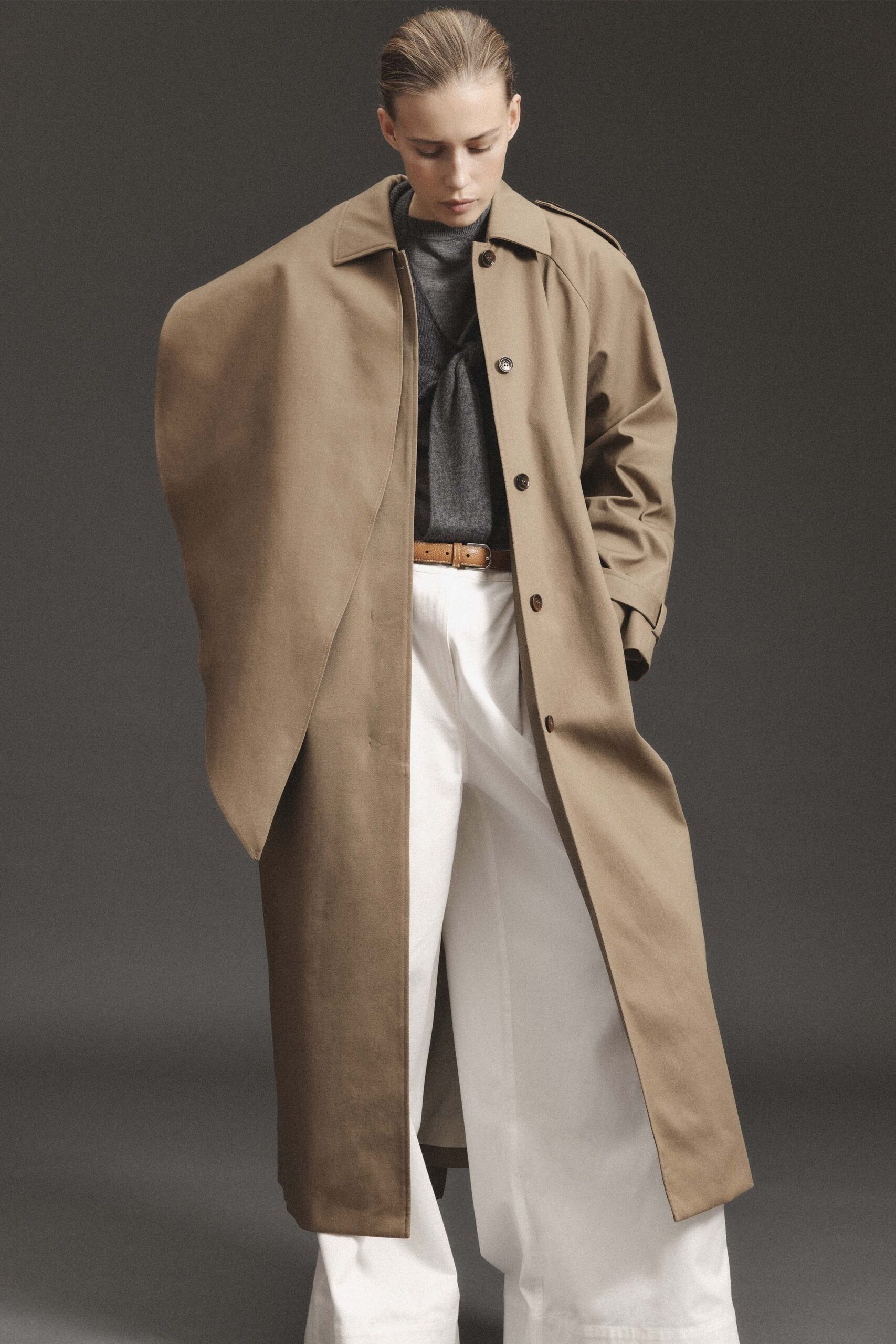 beige coat gray top white pants