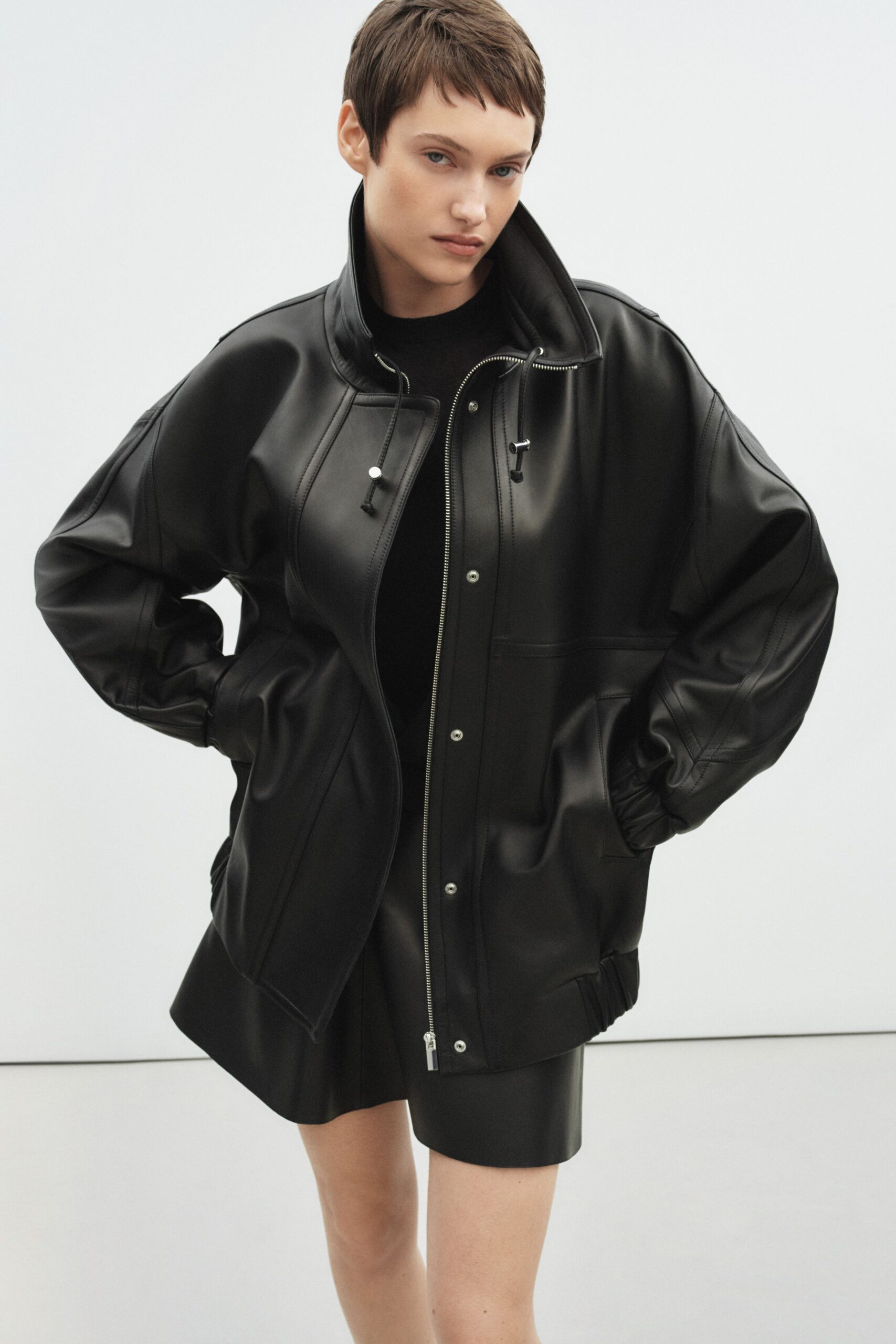black leather long-sleeve collared oversized jacket