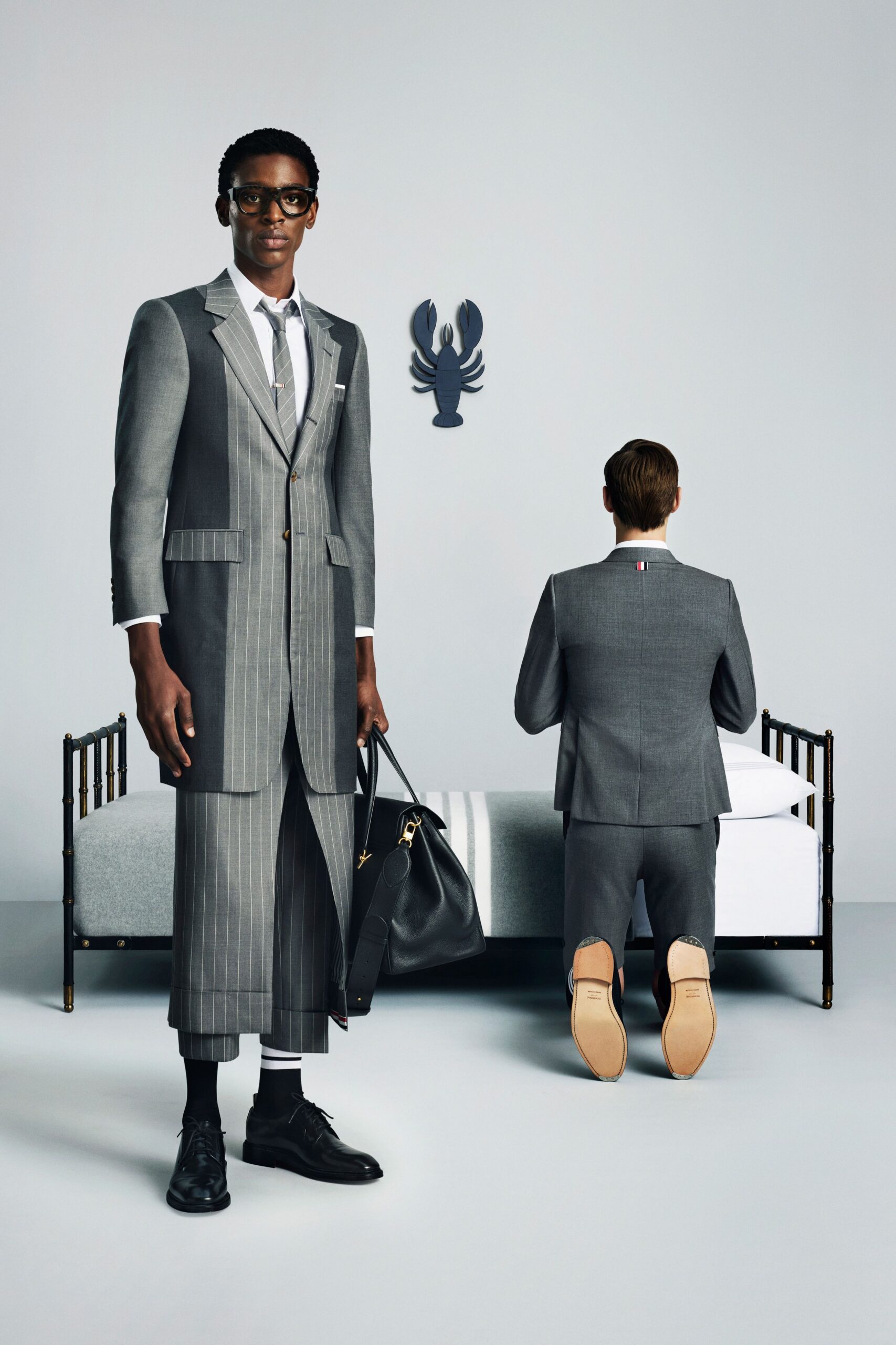 gray tailored suit with bag