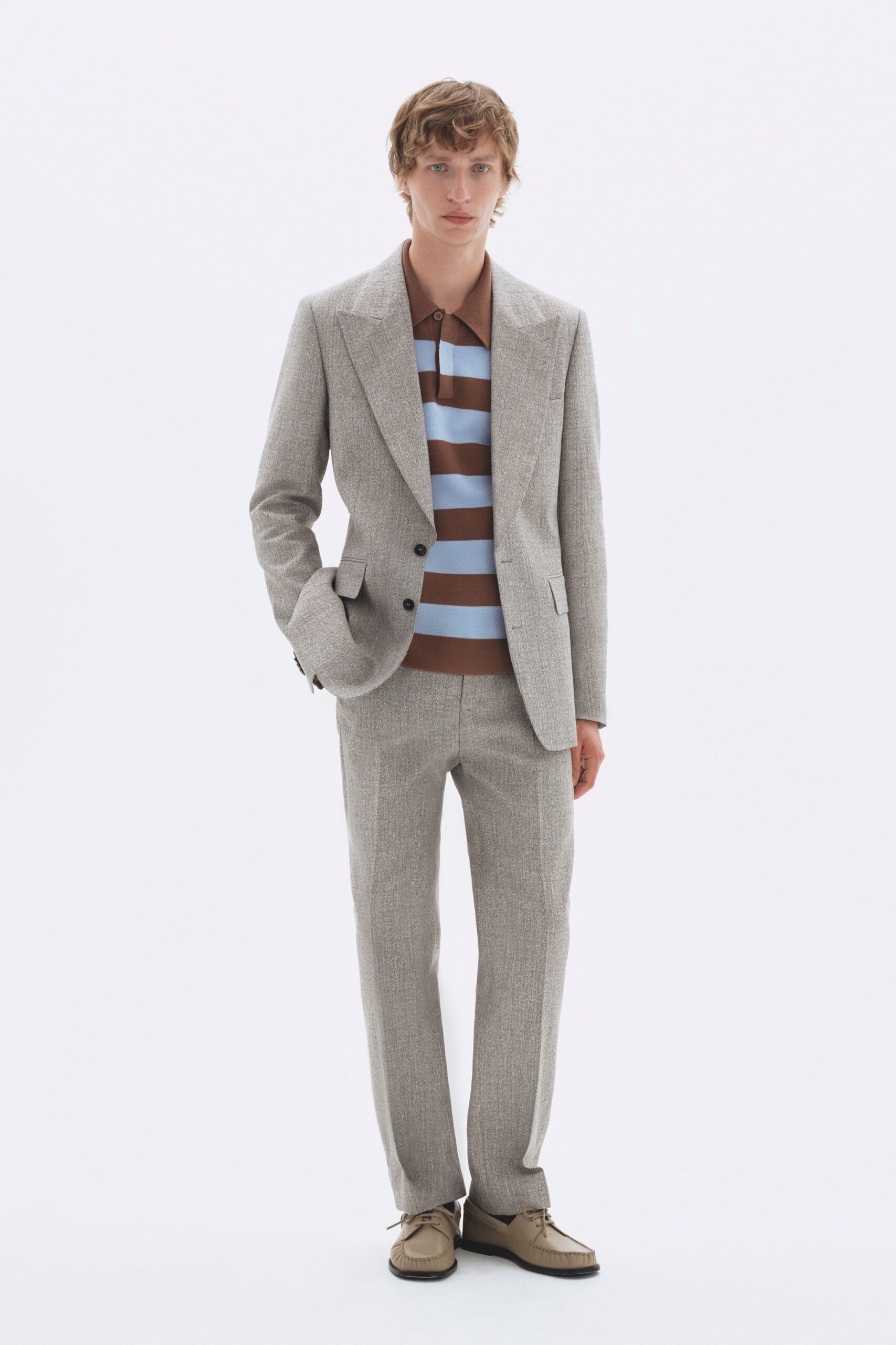 gray tailored suit with striped shirt