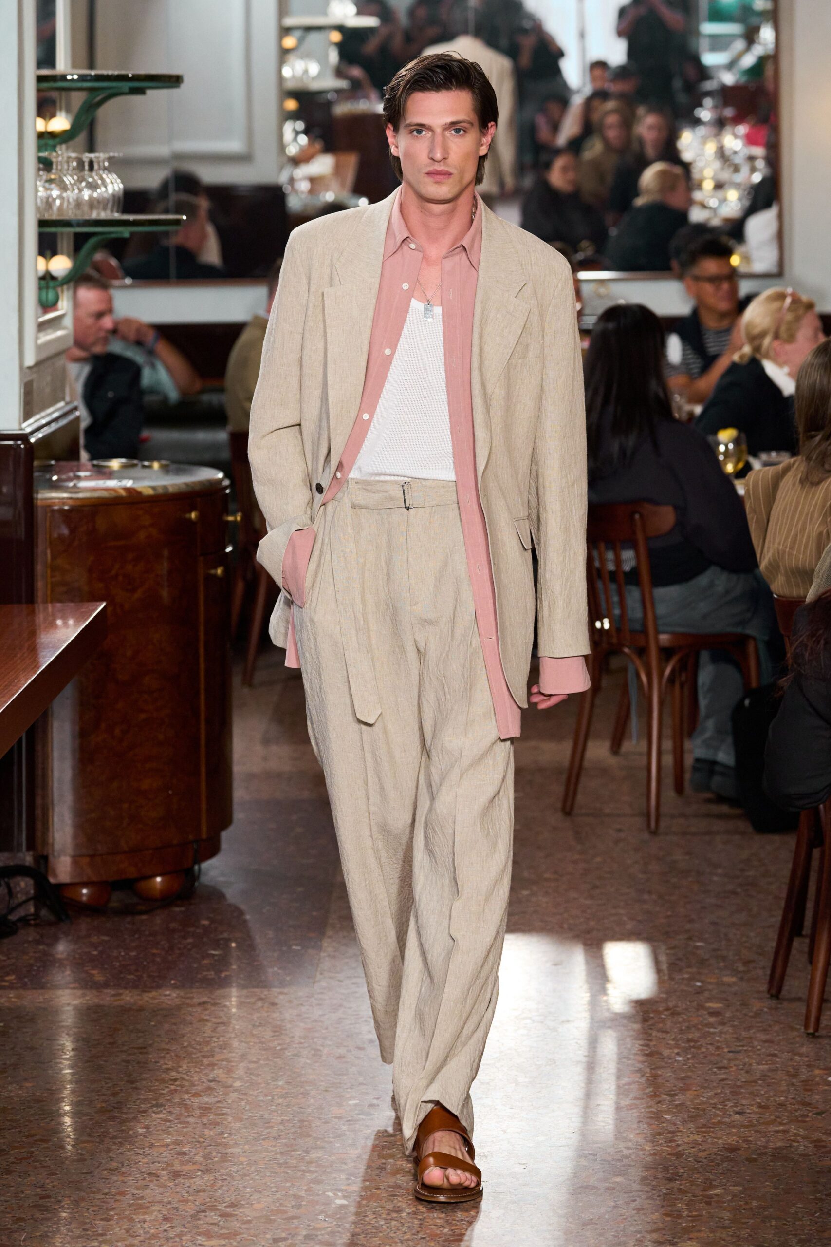 beige tailored suit with pink shirt