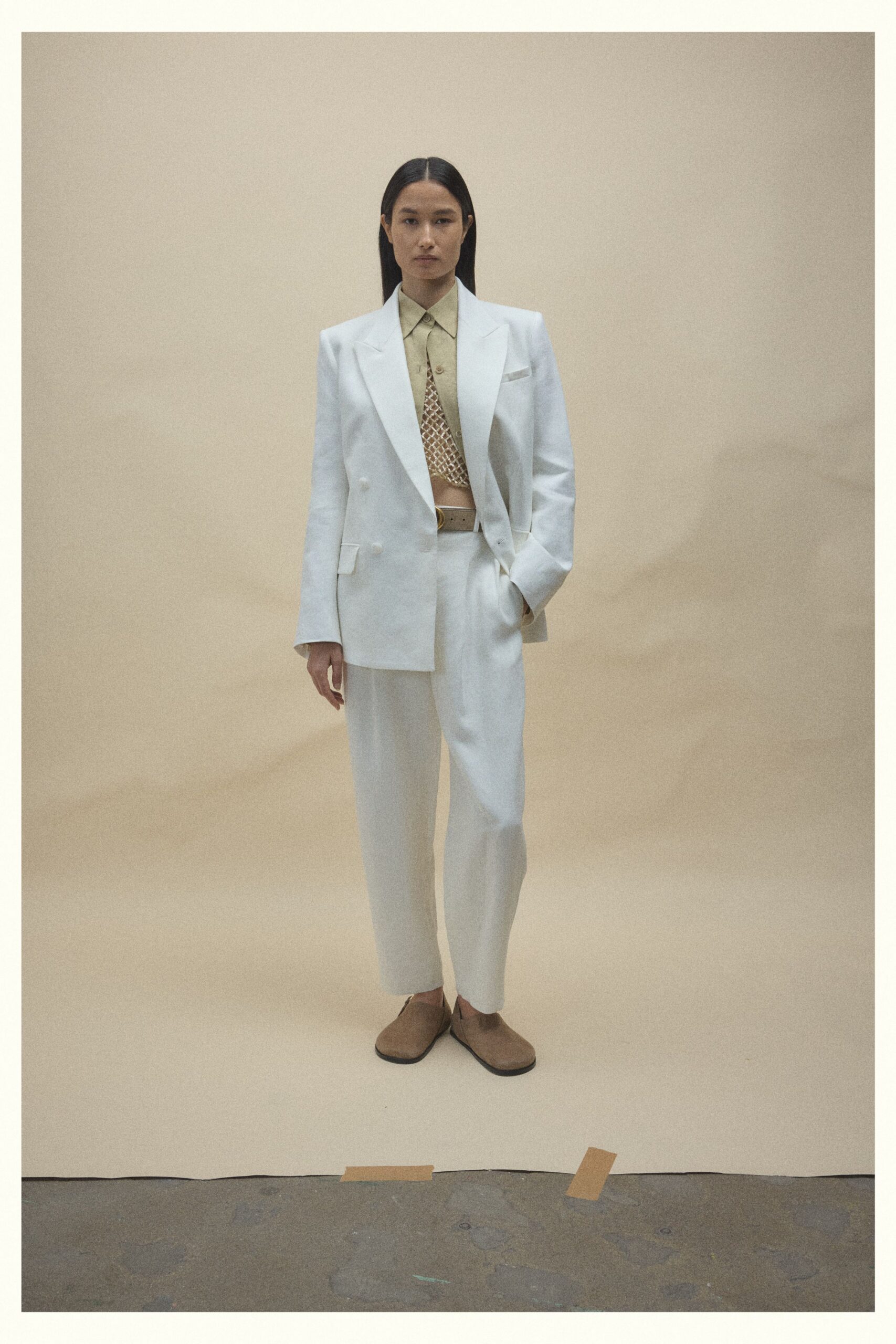 white tailored suit with beige shirt