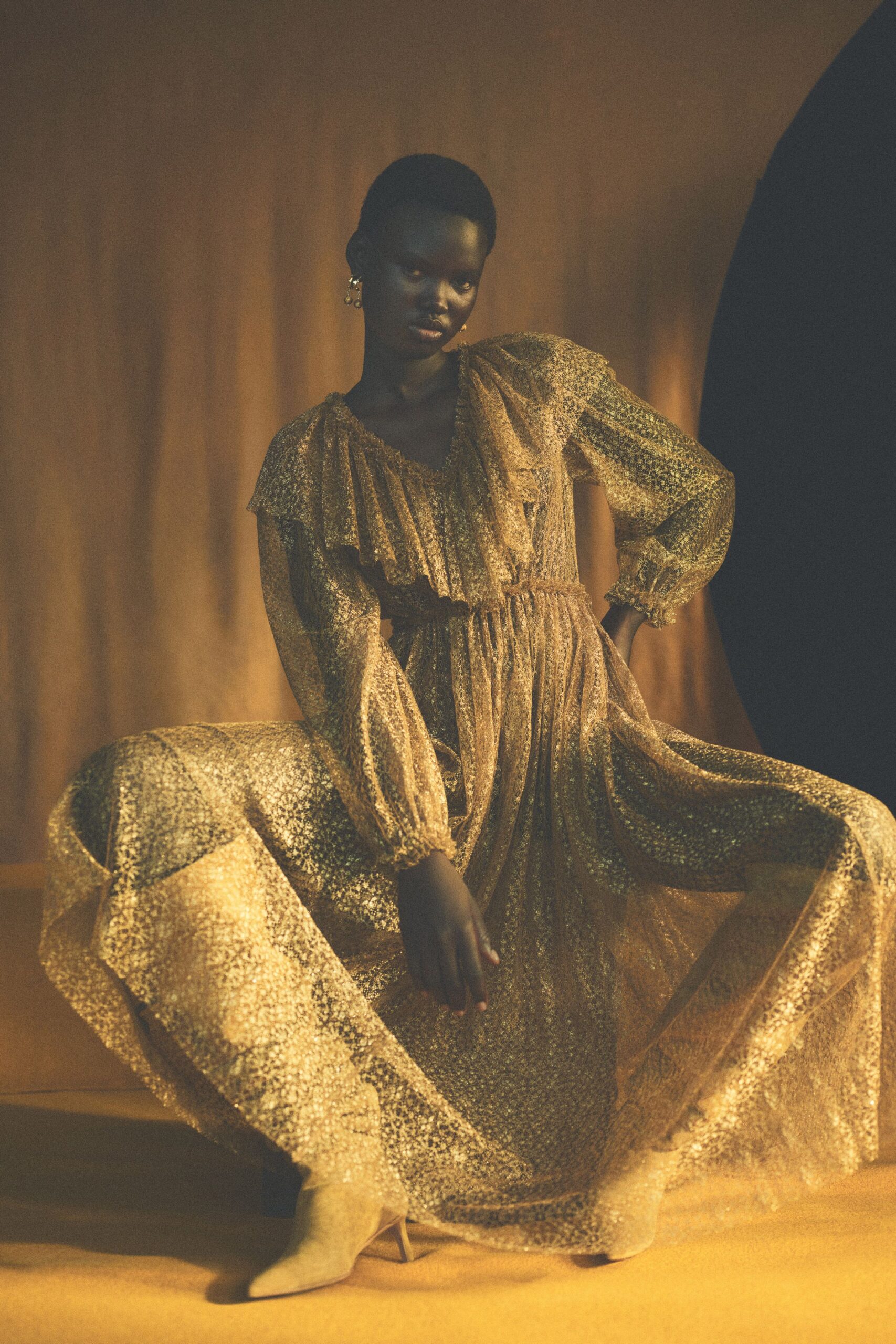 gold silk long-sleeve v-neck fitted pleated gown