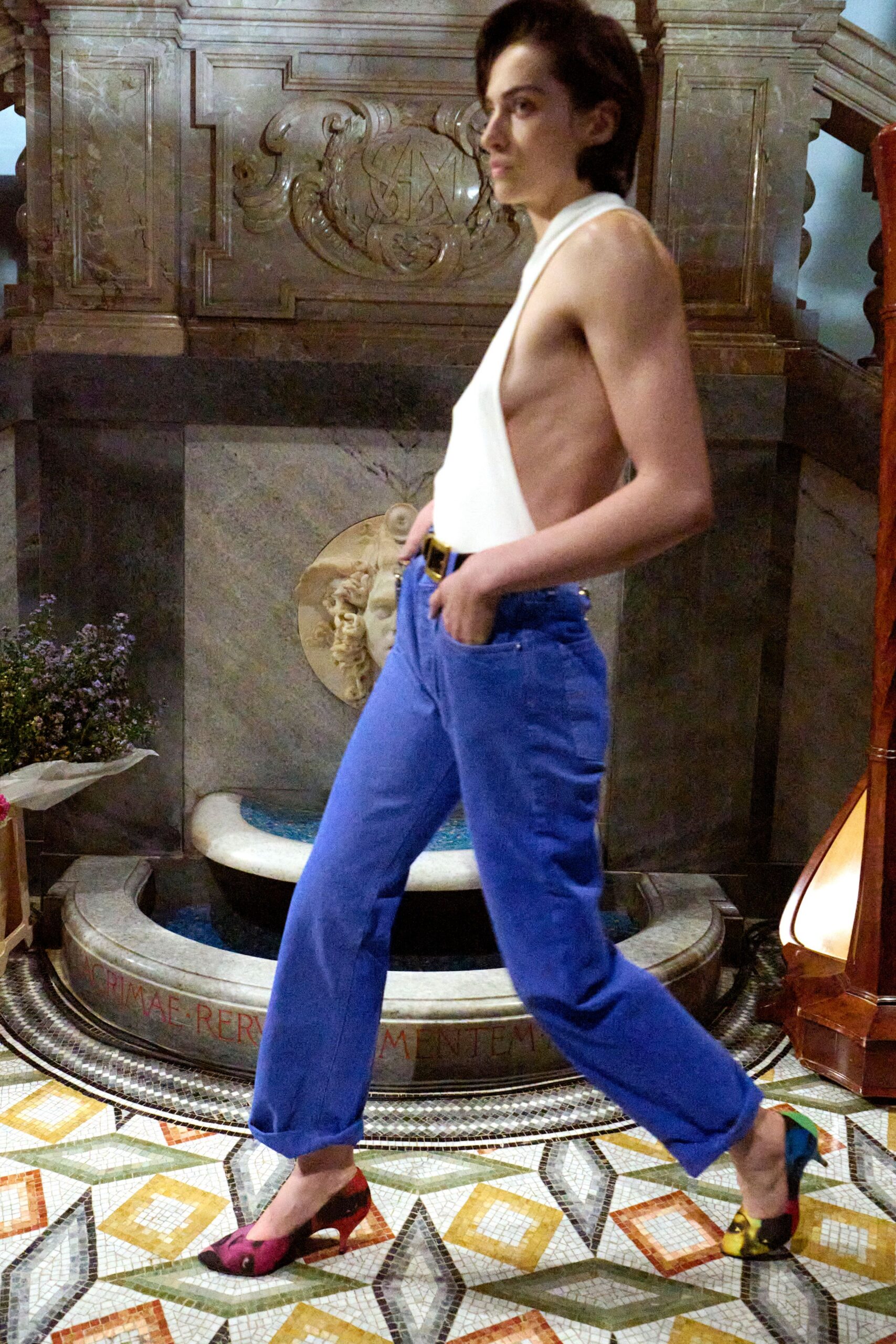 white sleeveless top with blue pants