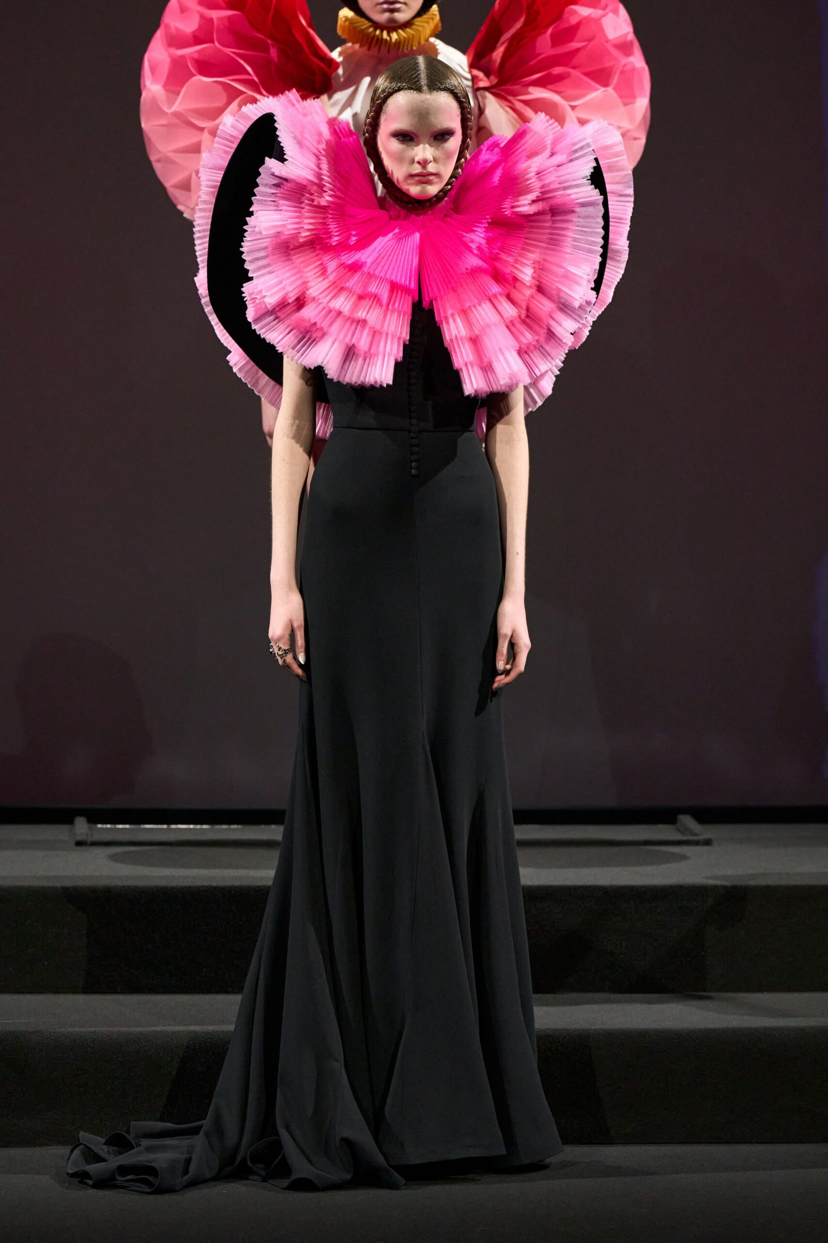 black silk fitted gown with pink cape