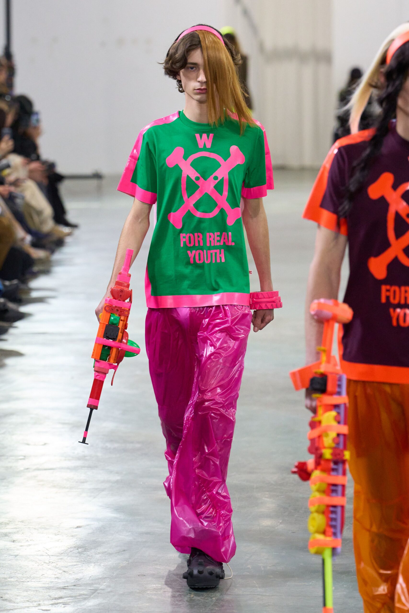 green pink printed t-shirt and pink vinyl pants