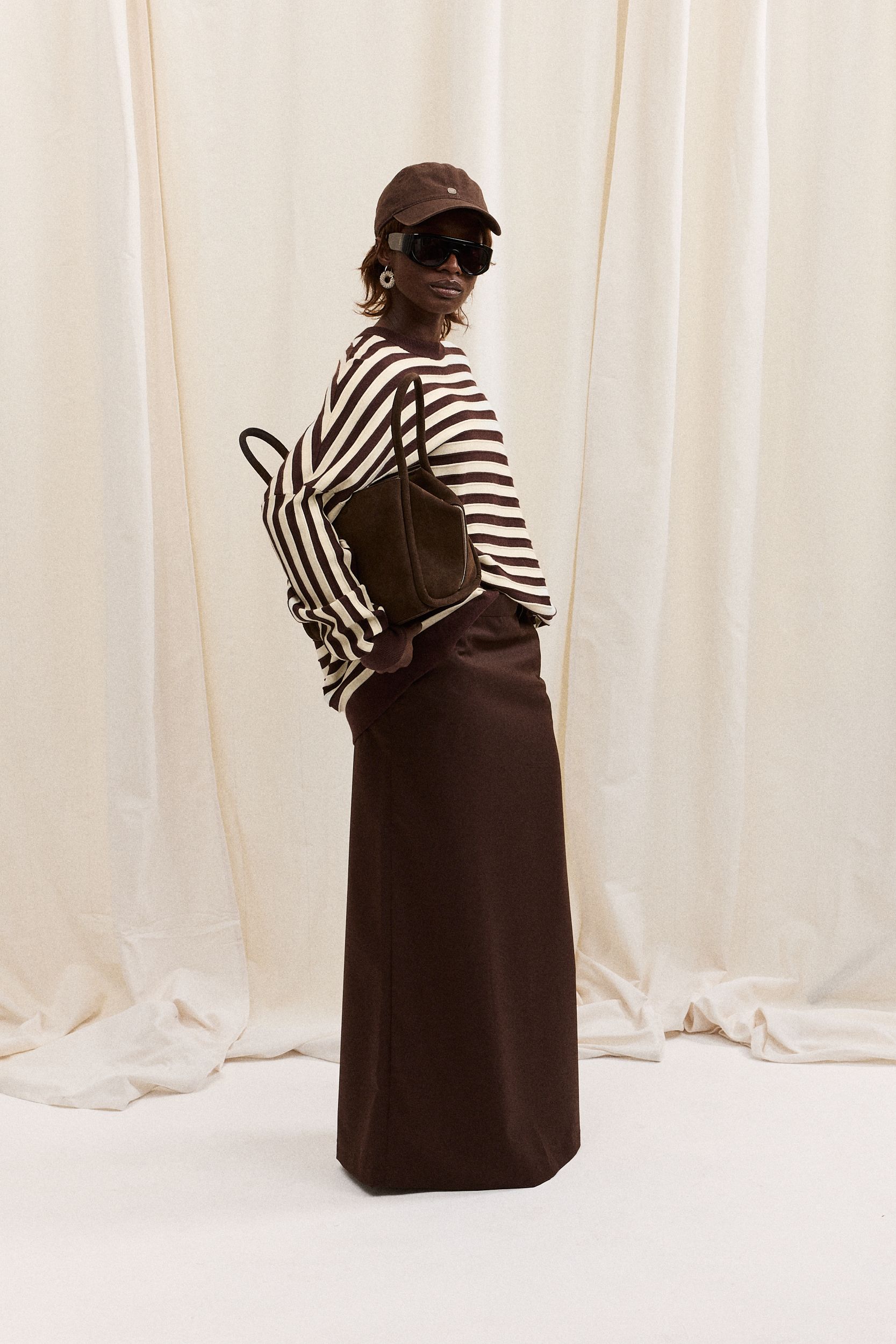 striped top and brown skirt