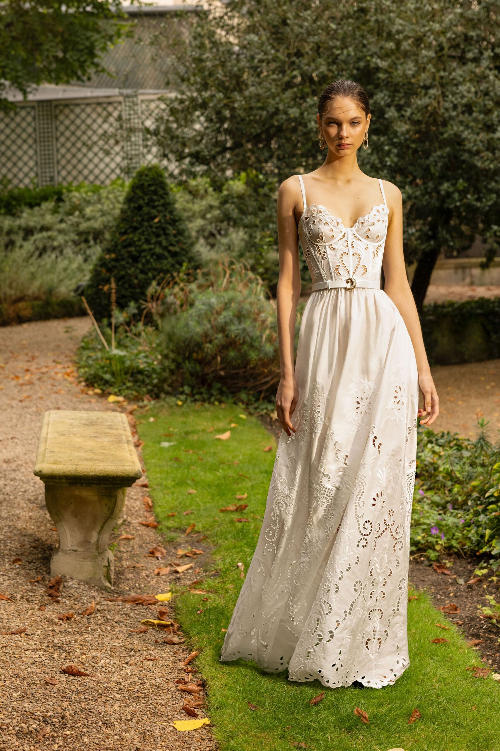 white embroidered sleeveless gown
