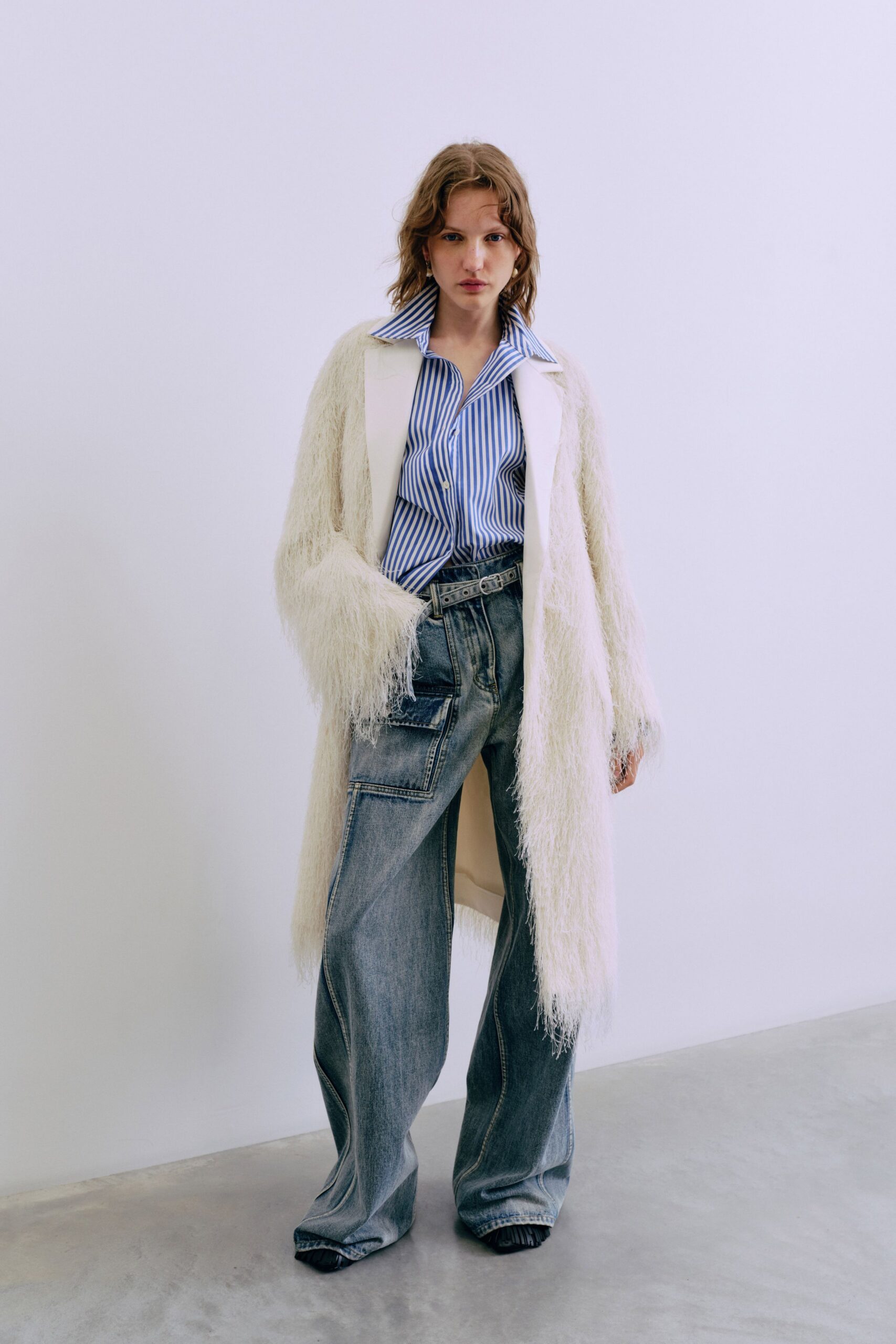 white fur coat blue striped shirt