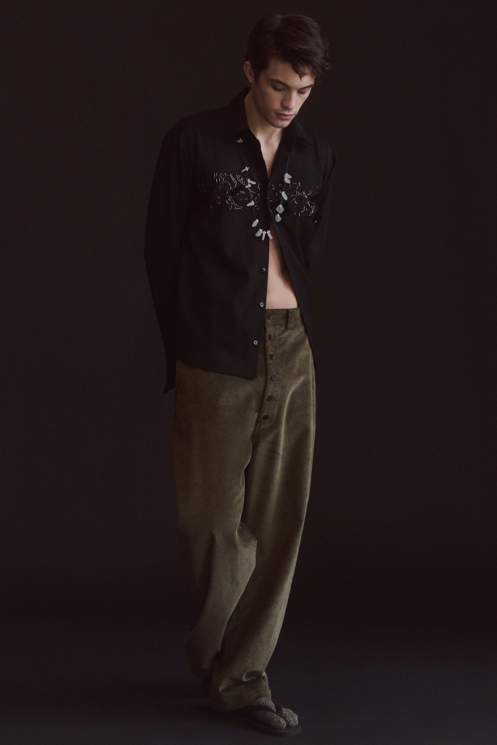 black embroidered shirt green pants
