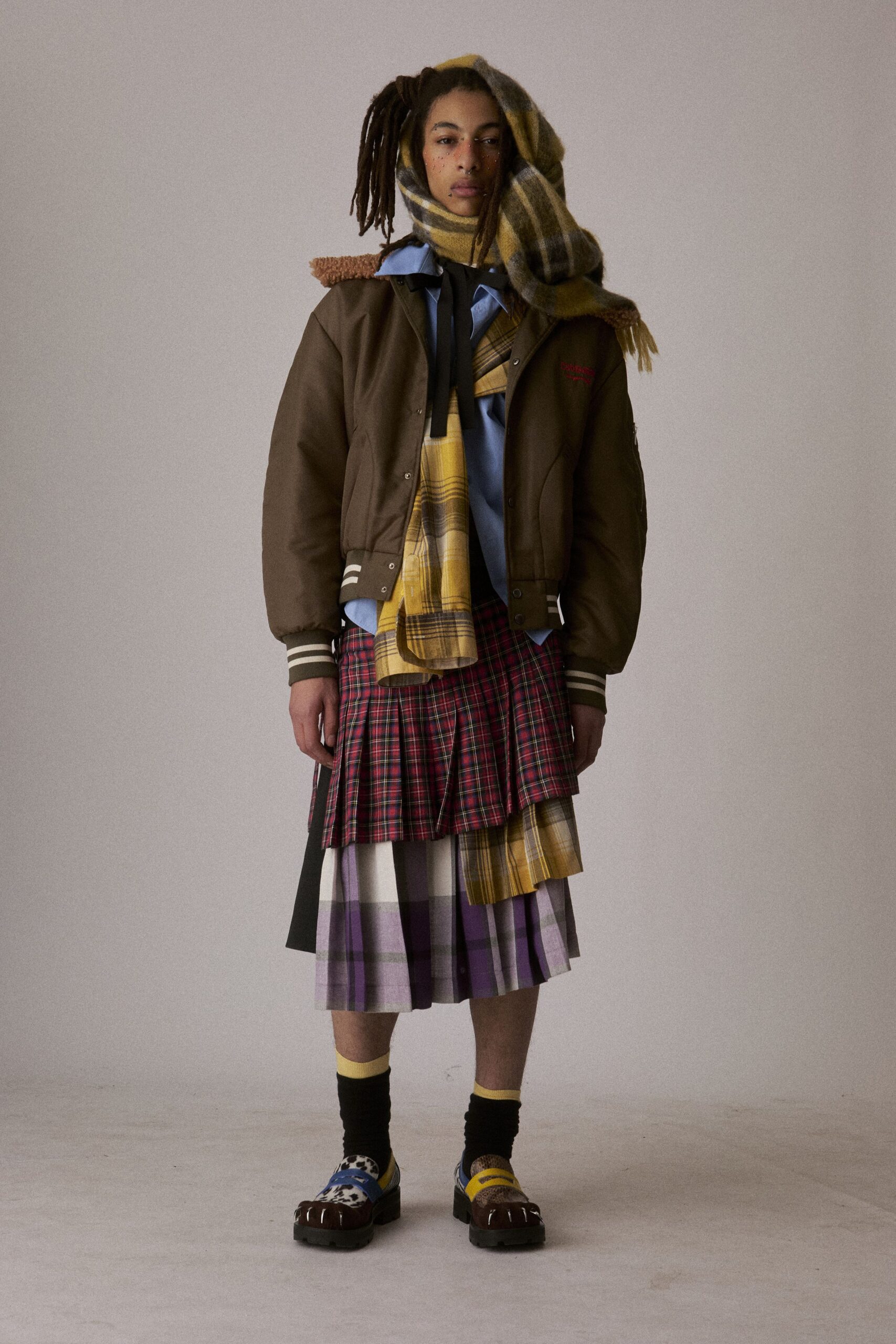brown relaxed jacket with pleated skirt