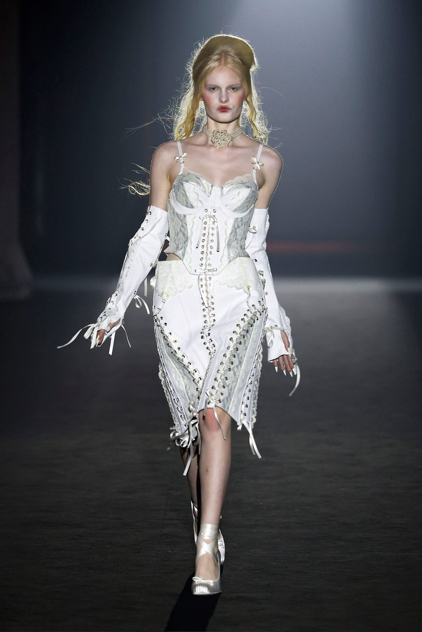 white embroidered midi dress with silver shoes