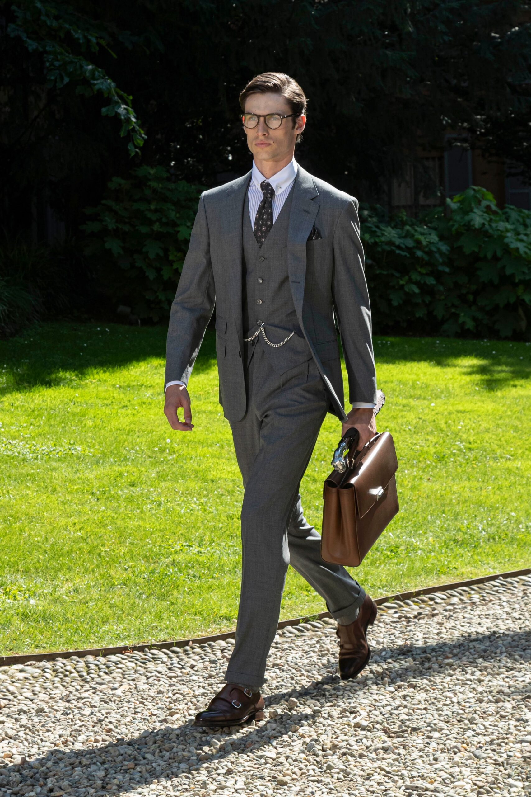 gray tailored suit with brown accessories