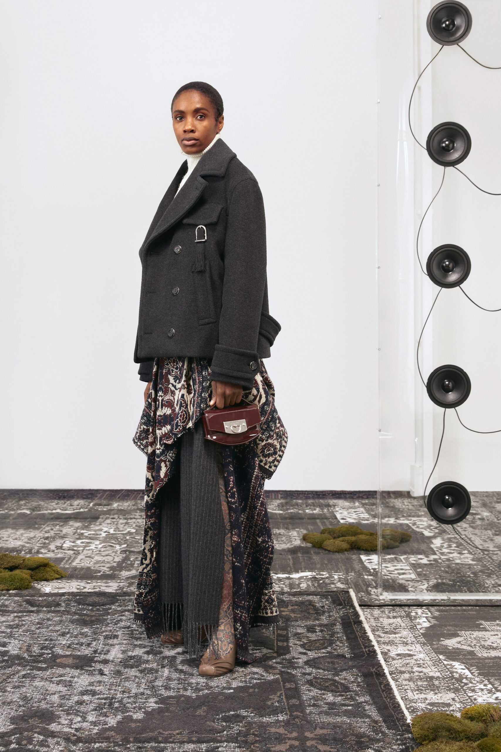 black wool coat with layered skirt