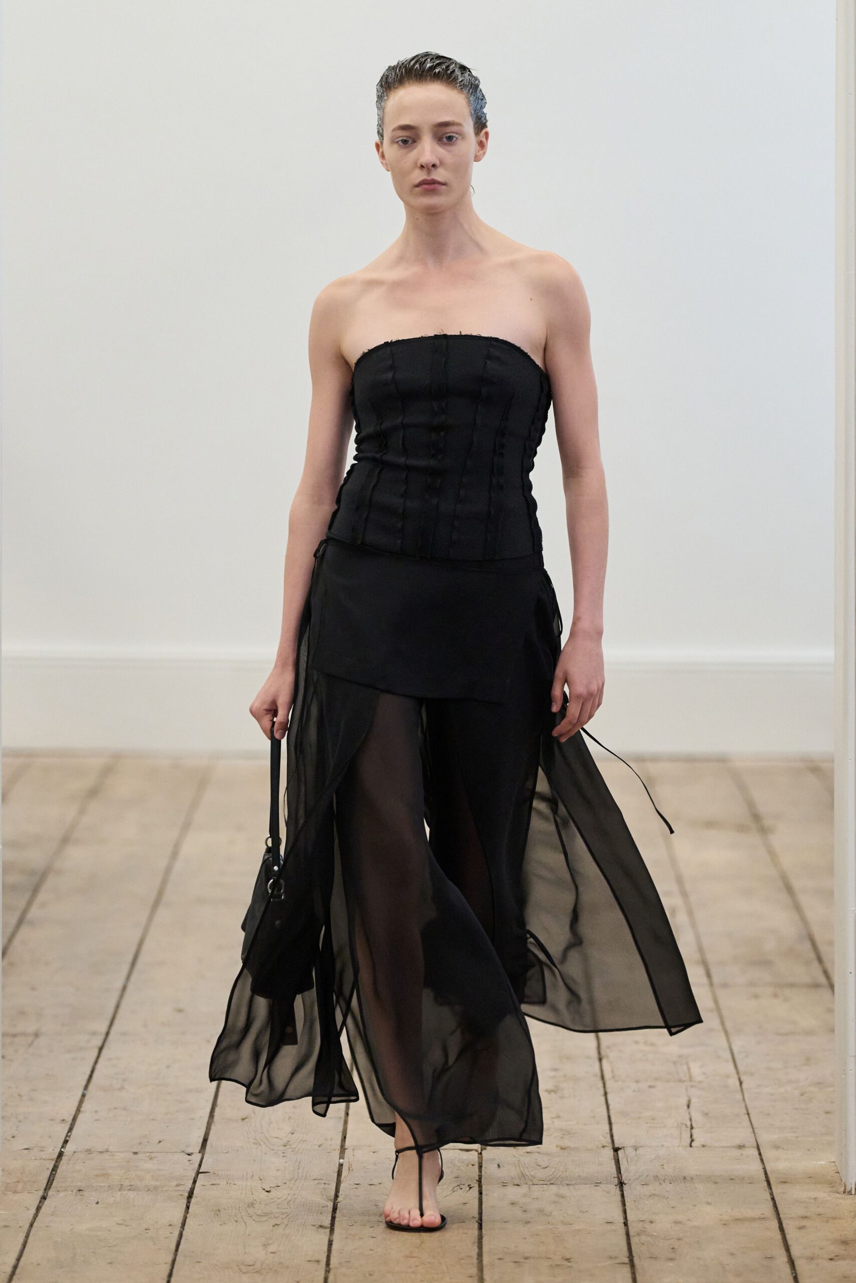 black silk strapless fitted pleated layered flowing gown