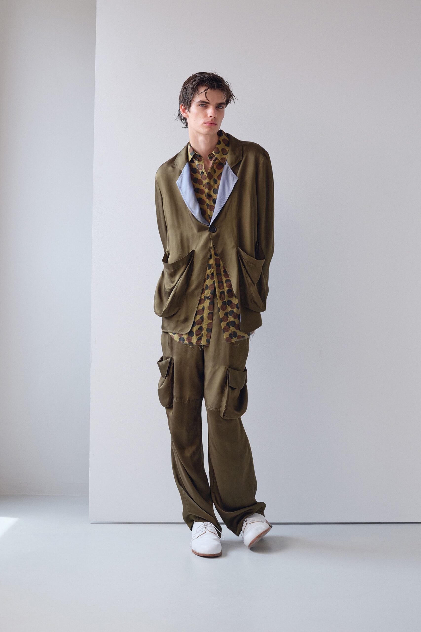 green silk relaxed suit with printed shirt