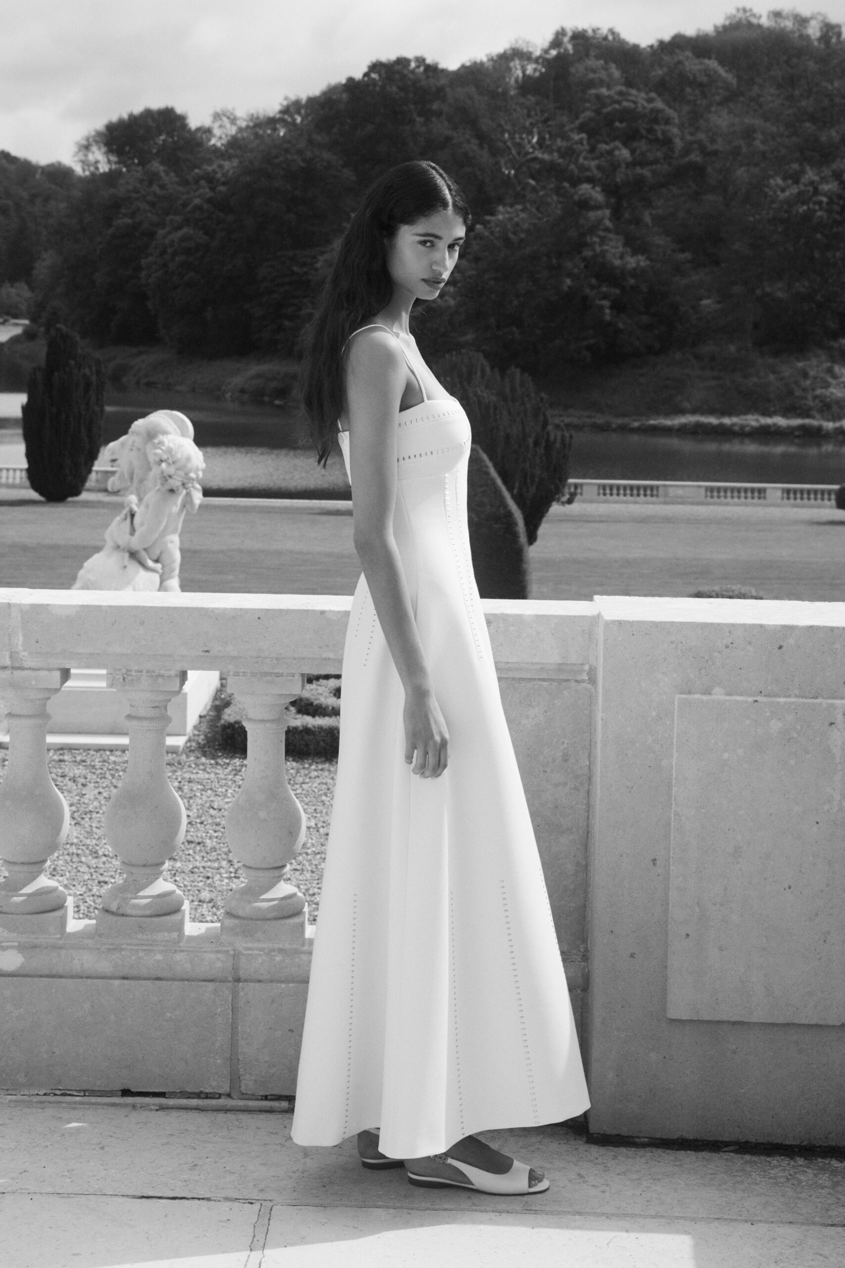 white cotton strapless fitted pleated maxi gown