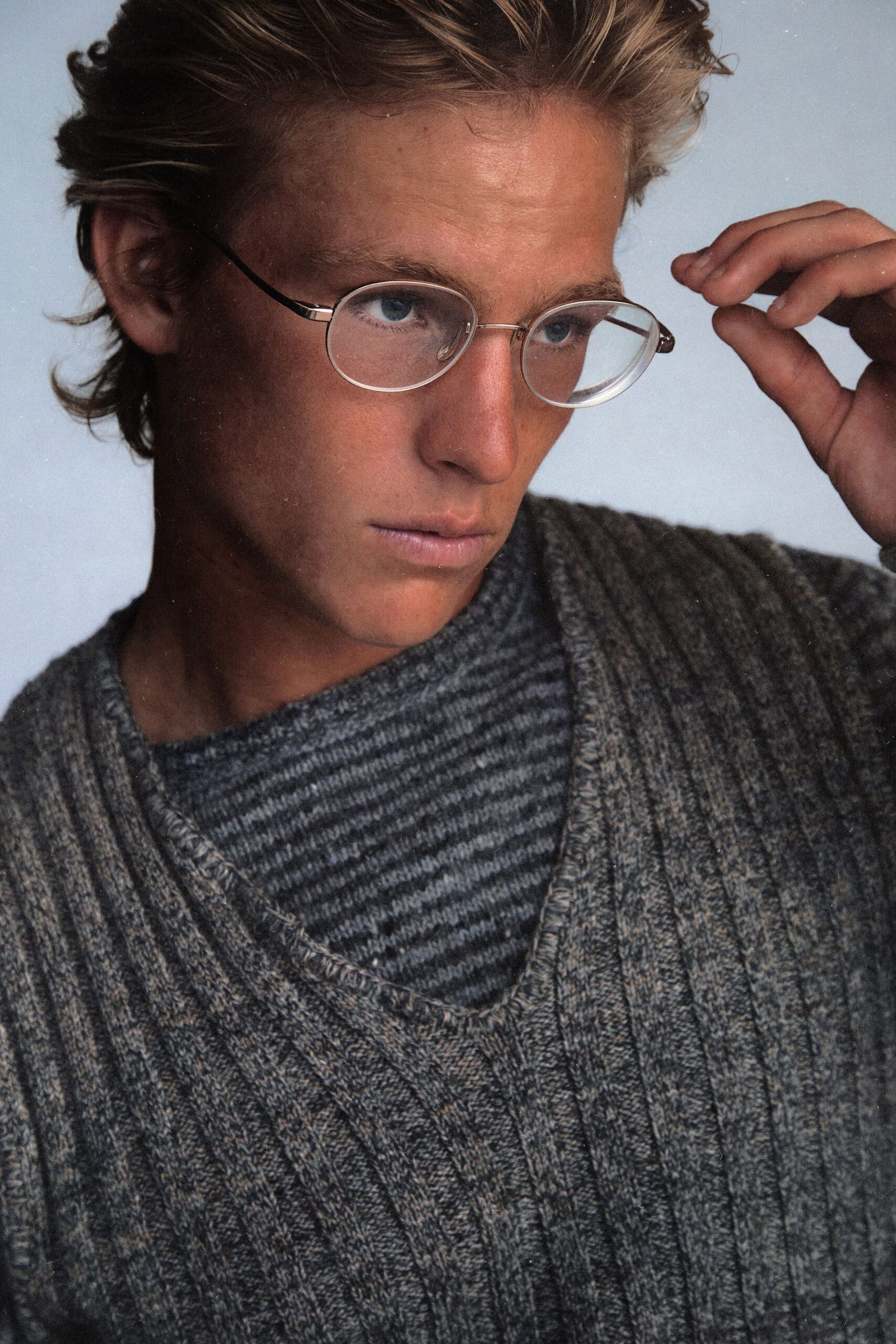 gray ribbed sweater with striped shirt