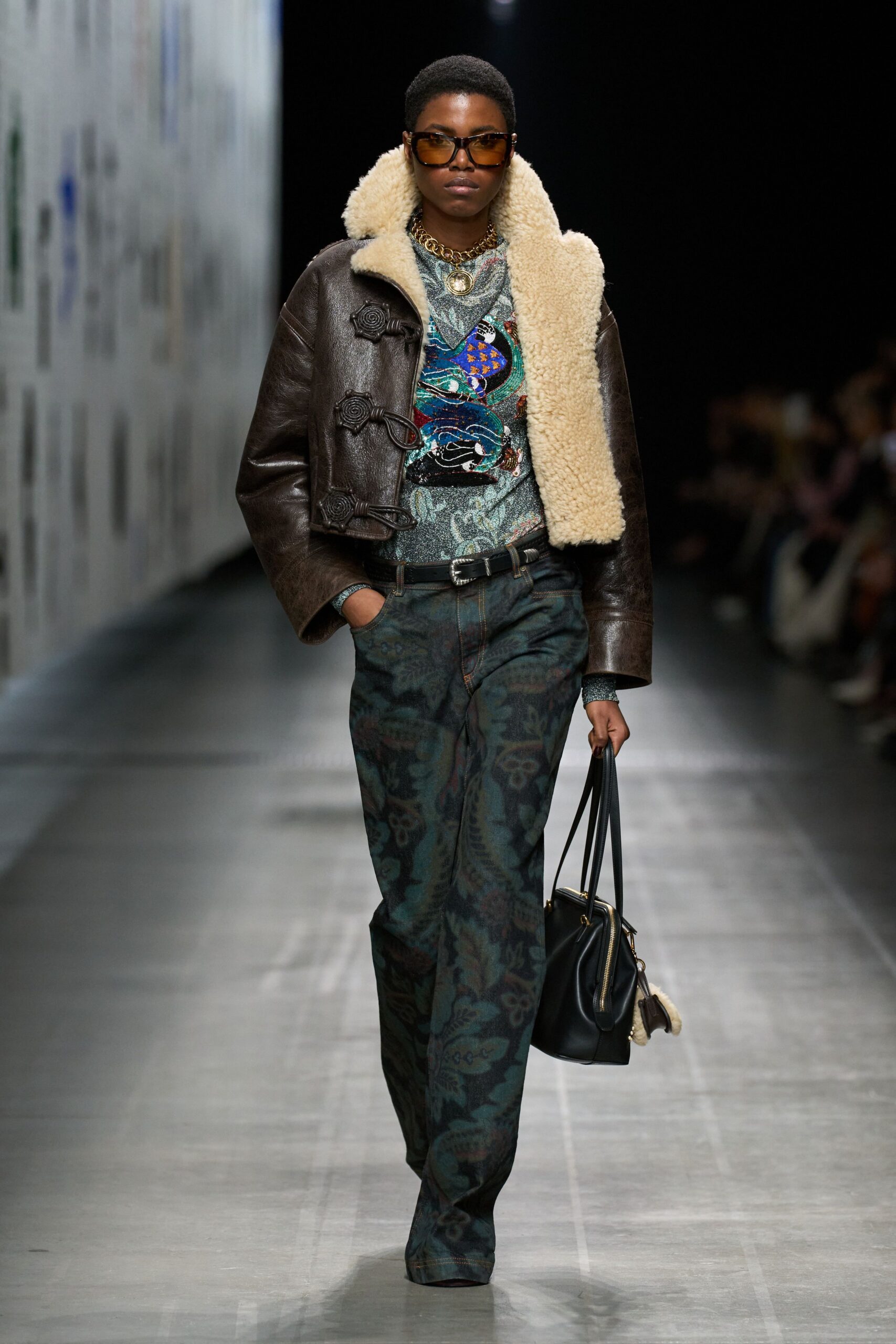 brown leather jacket with printed top