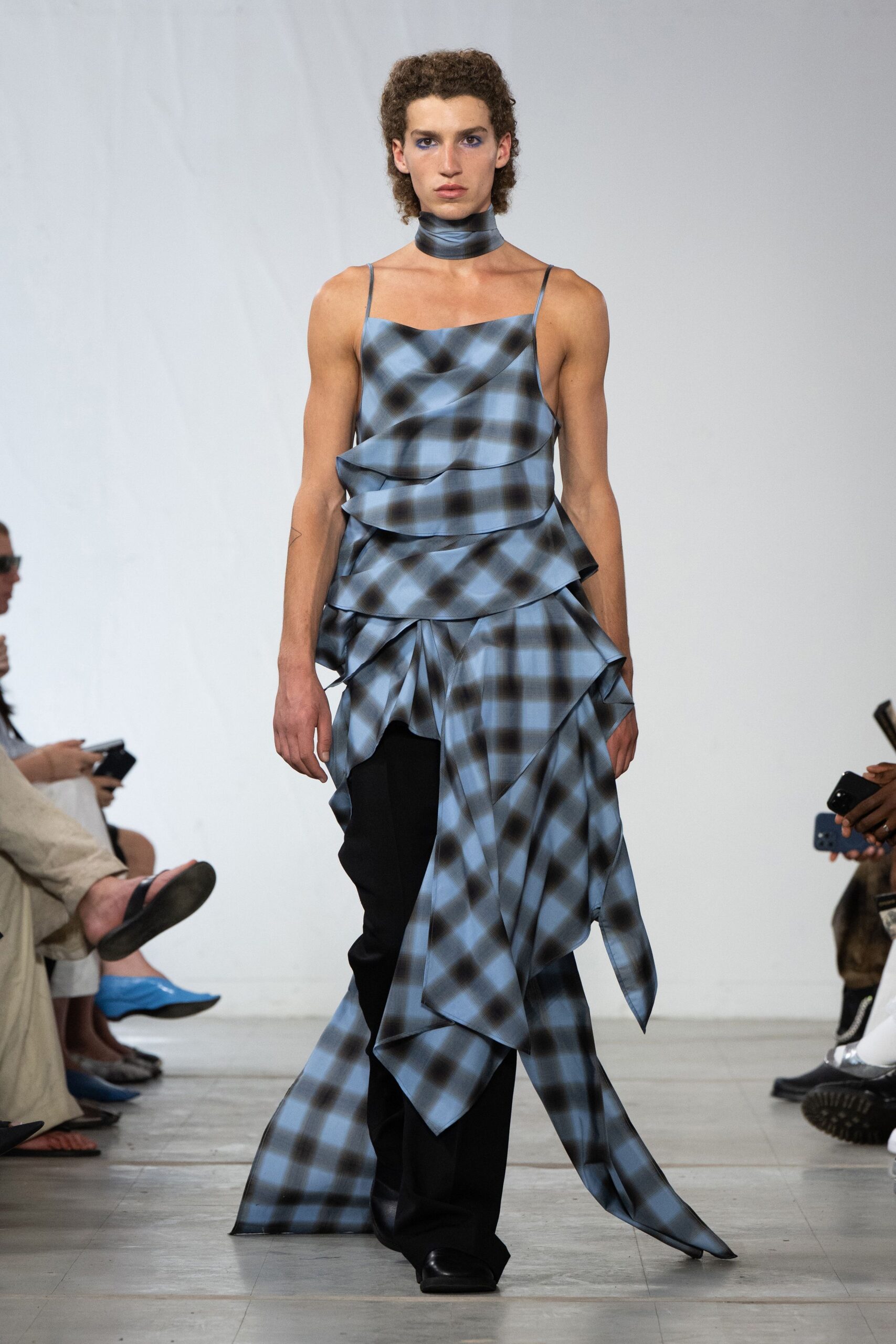 blue plaid layered top with black pants