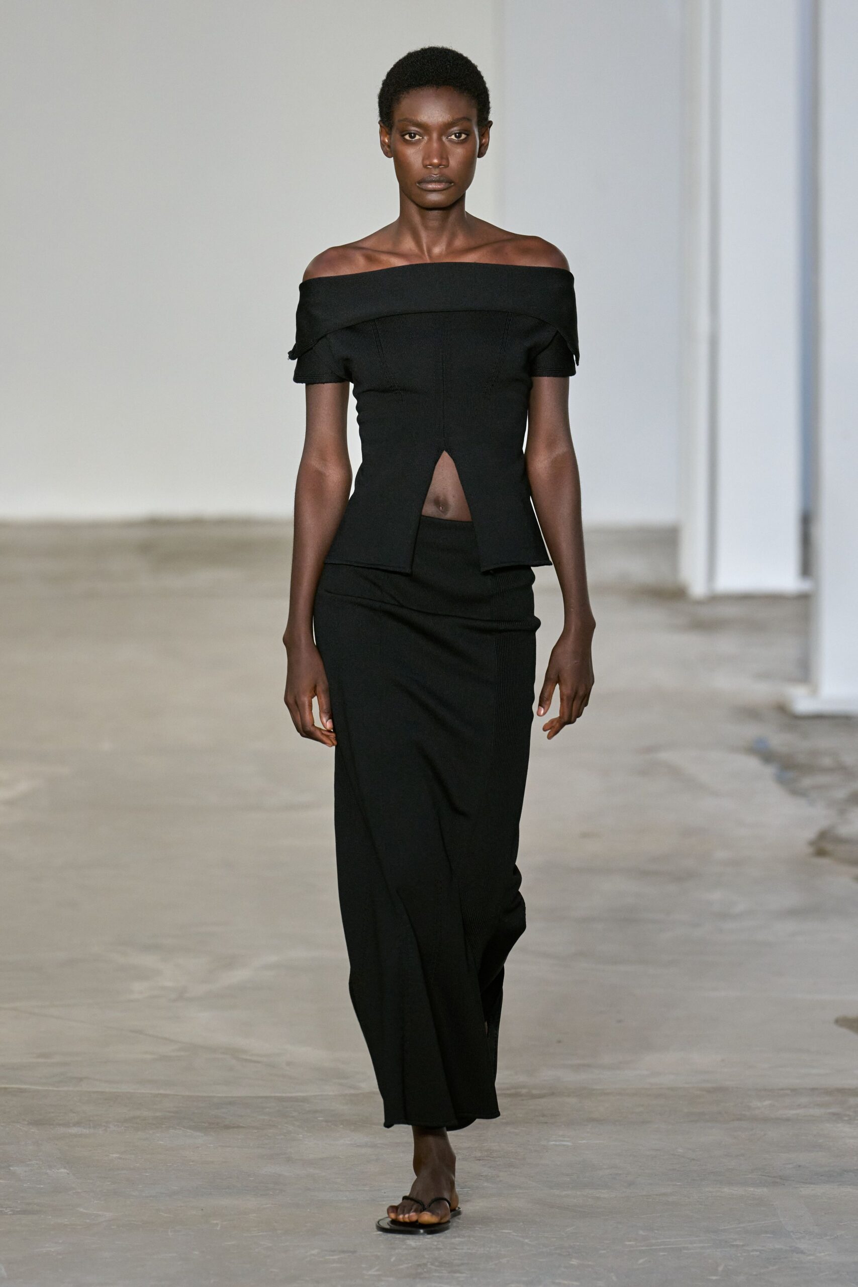 black fitted top and midi skirt