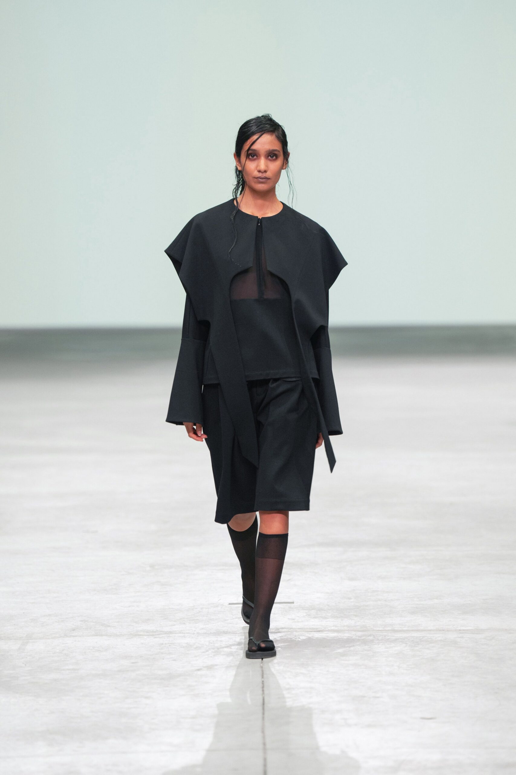 black relaxed top and fitted skirt