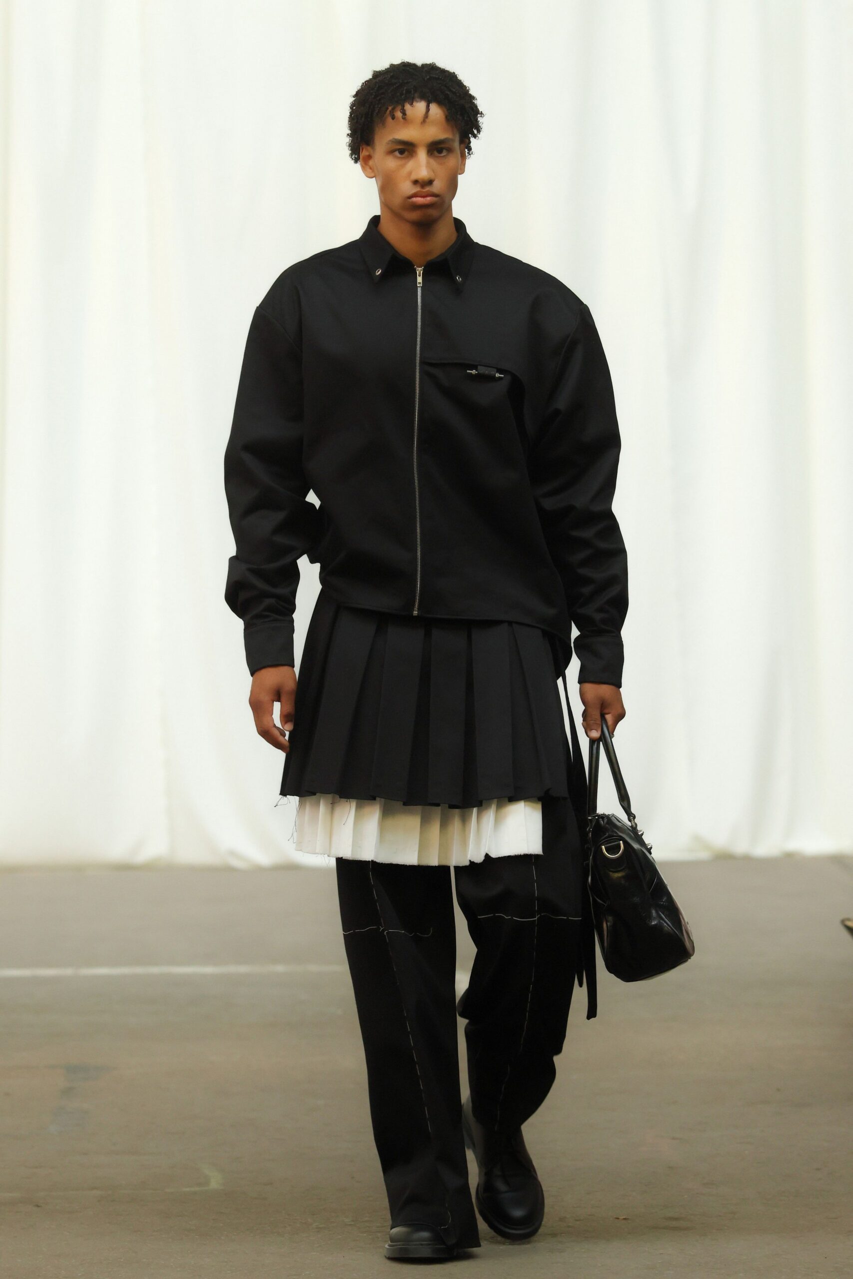 black relaxed jacket with pleated skirt