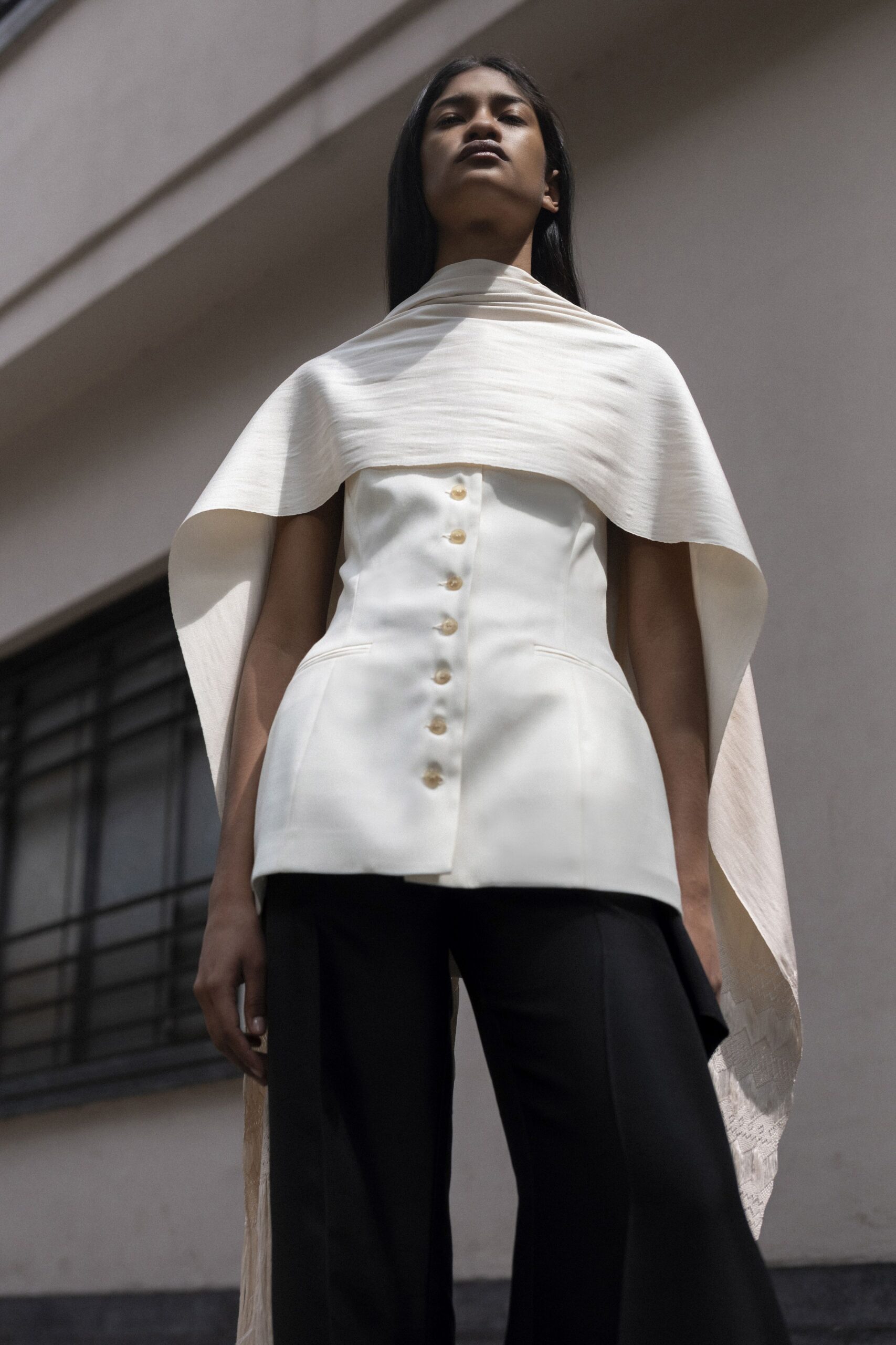 white silk sleeveless collared fitted buttoned layered top