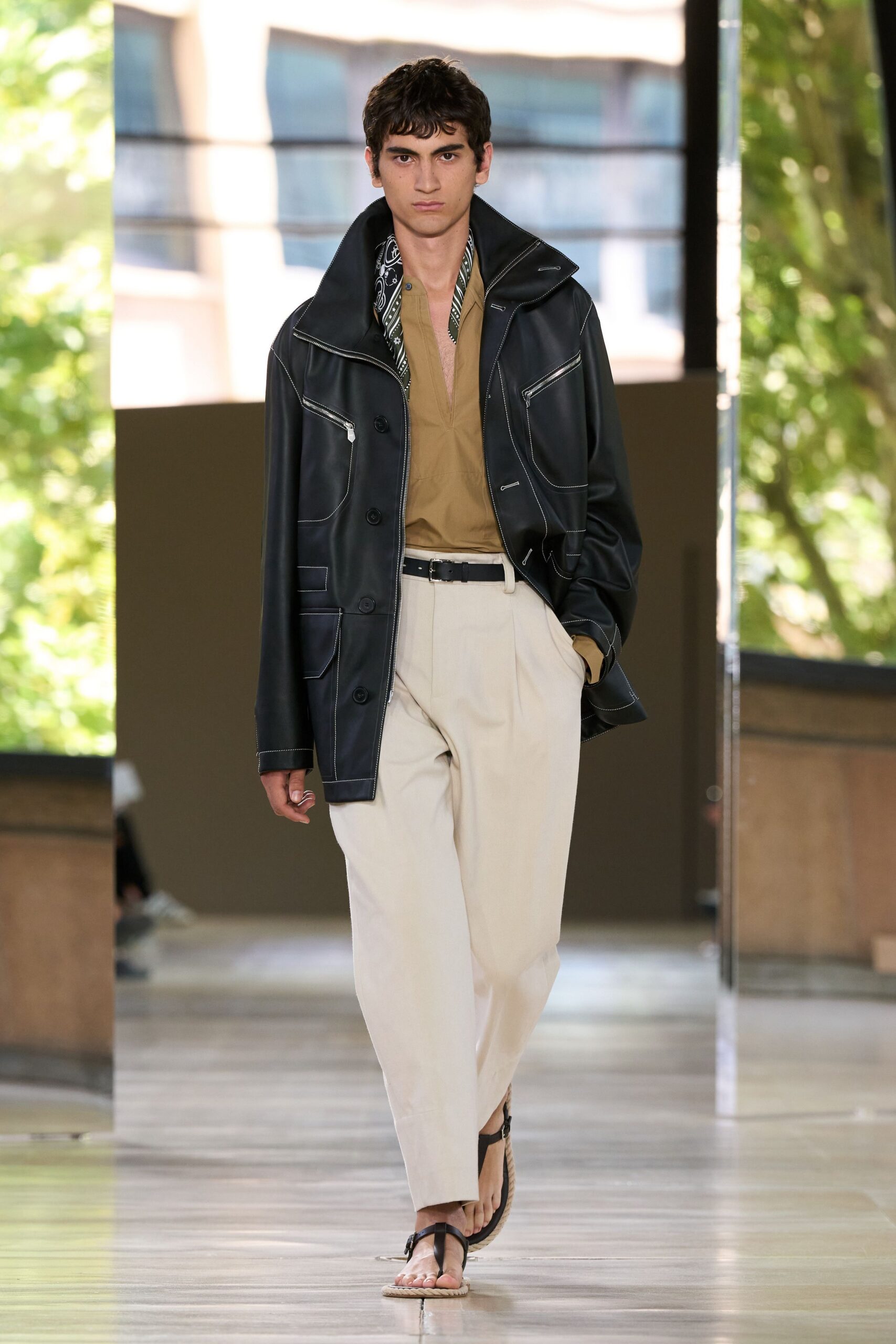 black leather jacket beige shirt white pants