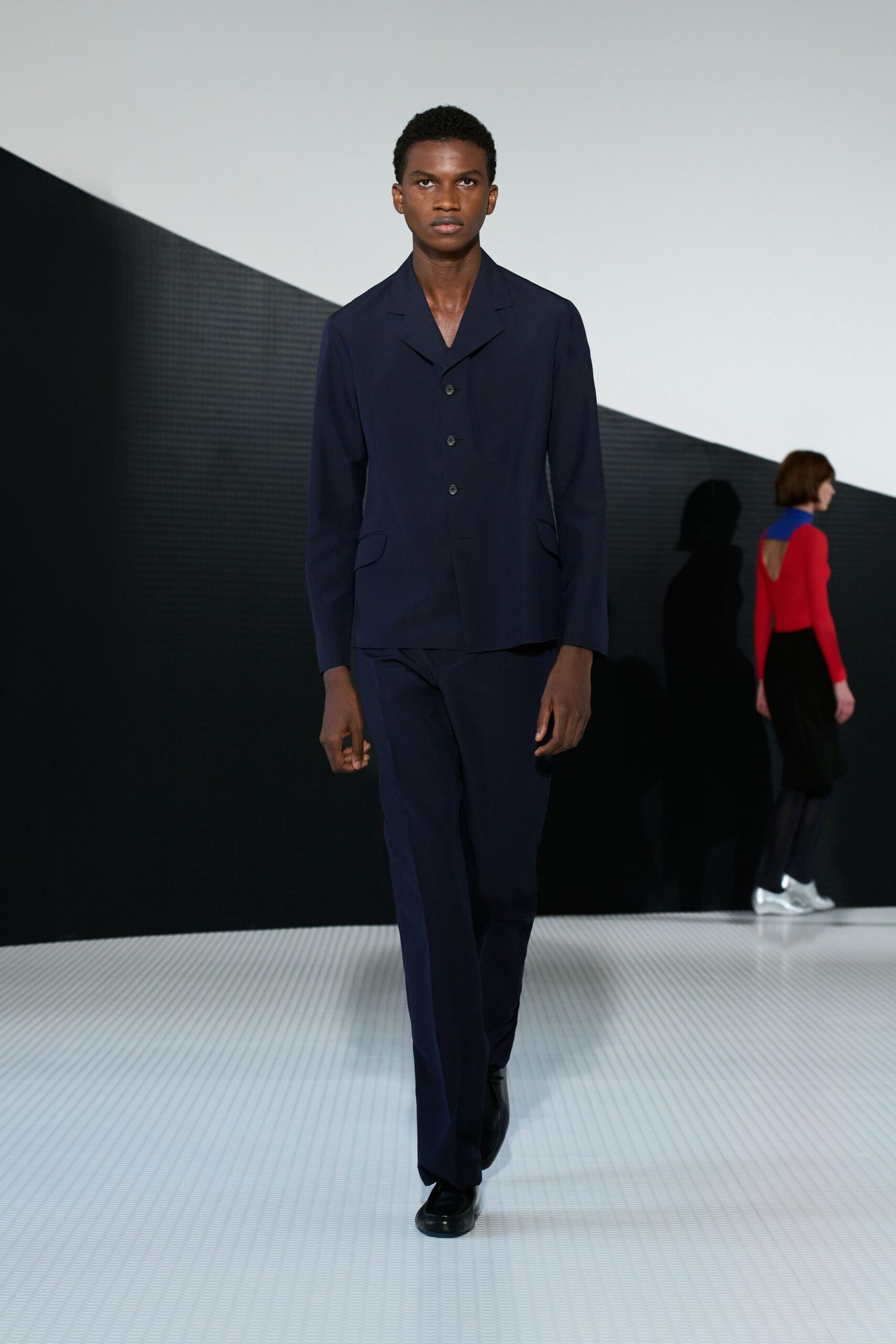 blue tailored suit with black shoes
