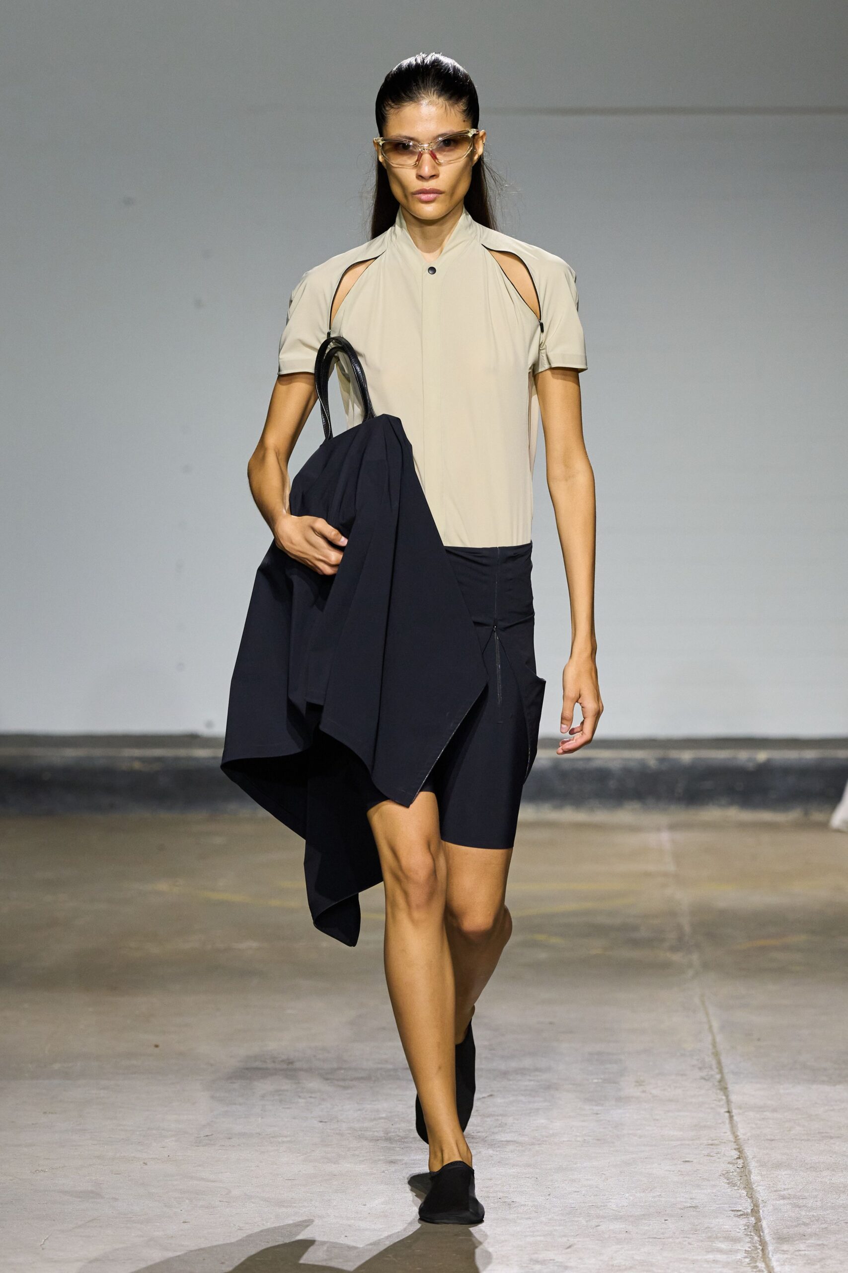 beige fitted top with black shorts