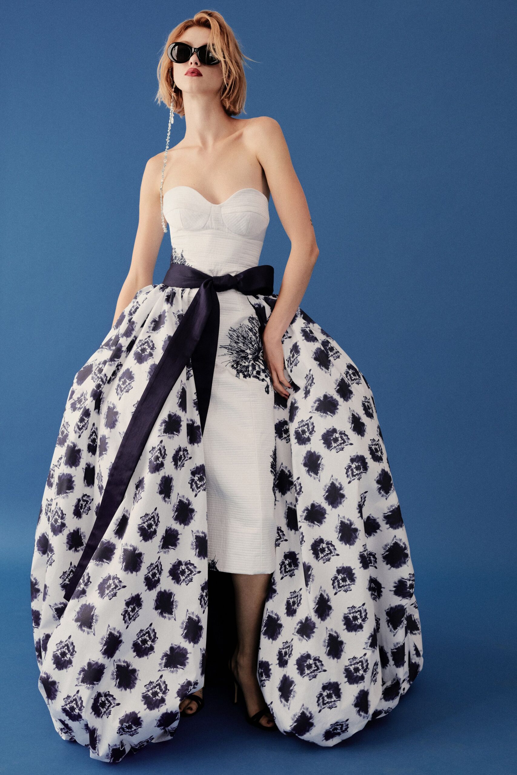 white silk strapless fitted flared printed maxi gown
